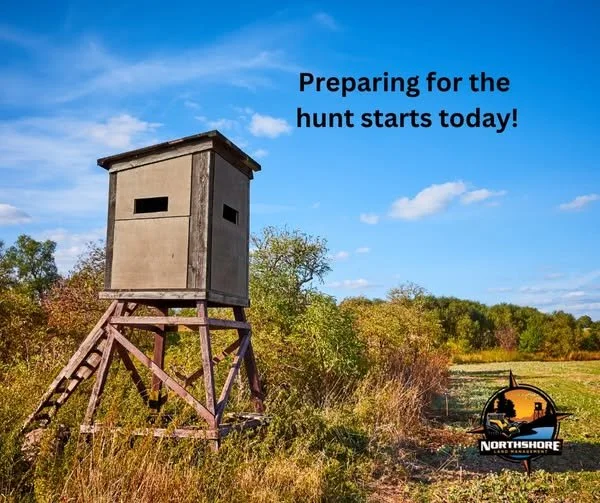 Elevated deer hunting stand in a grassy field with a clear blue sky, accompanied by the text 'Preparing for the hunt starts today!' and a Northshore logo in the corner.