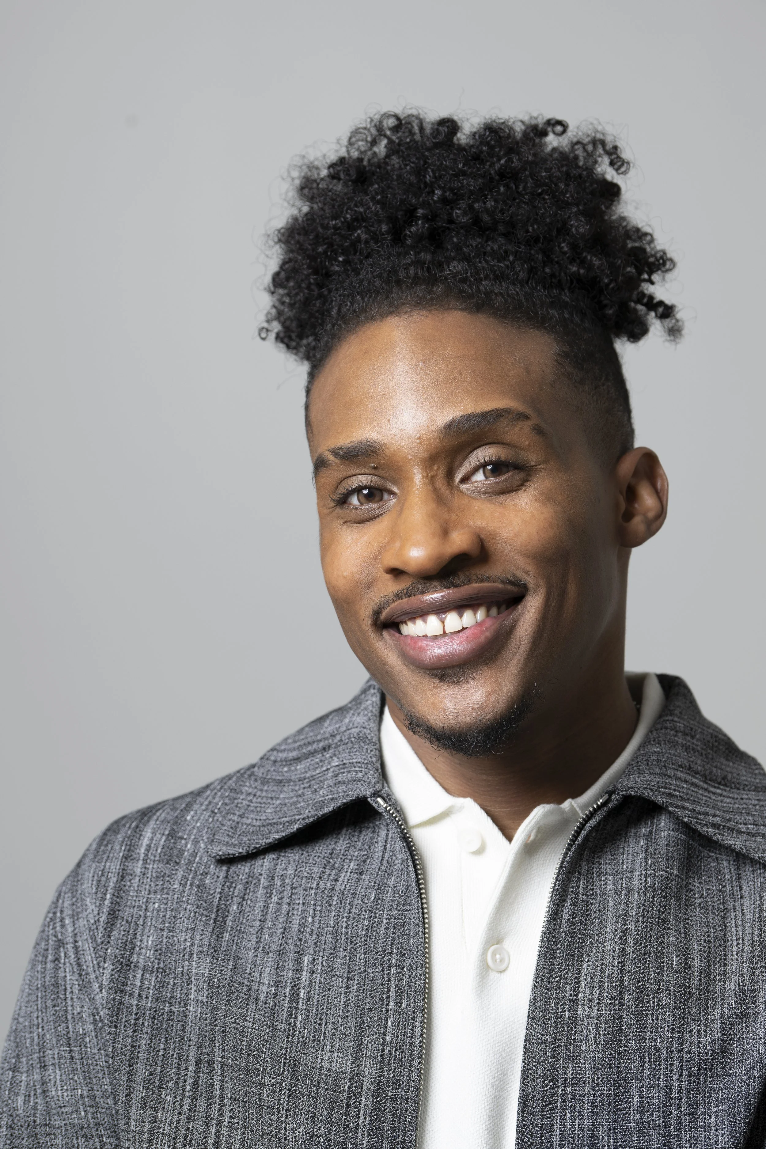 Griffin Garnett smiling in a professional actor headshot