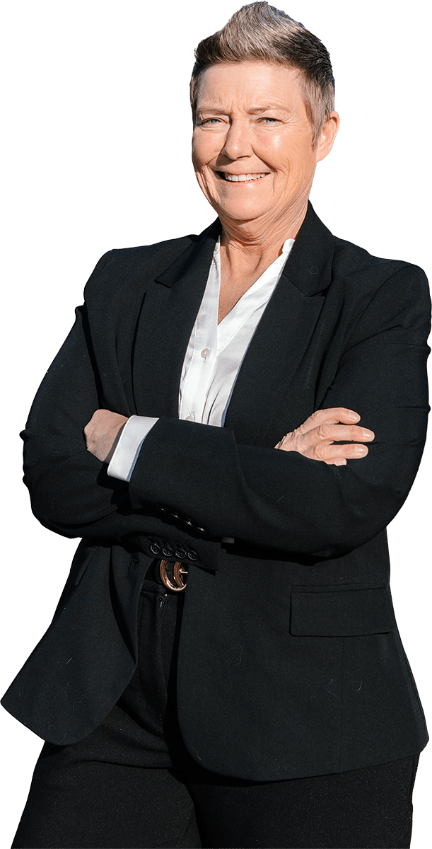 Marla Palmer in busienss attire standing with her arms crossed