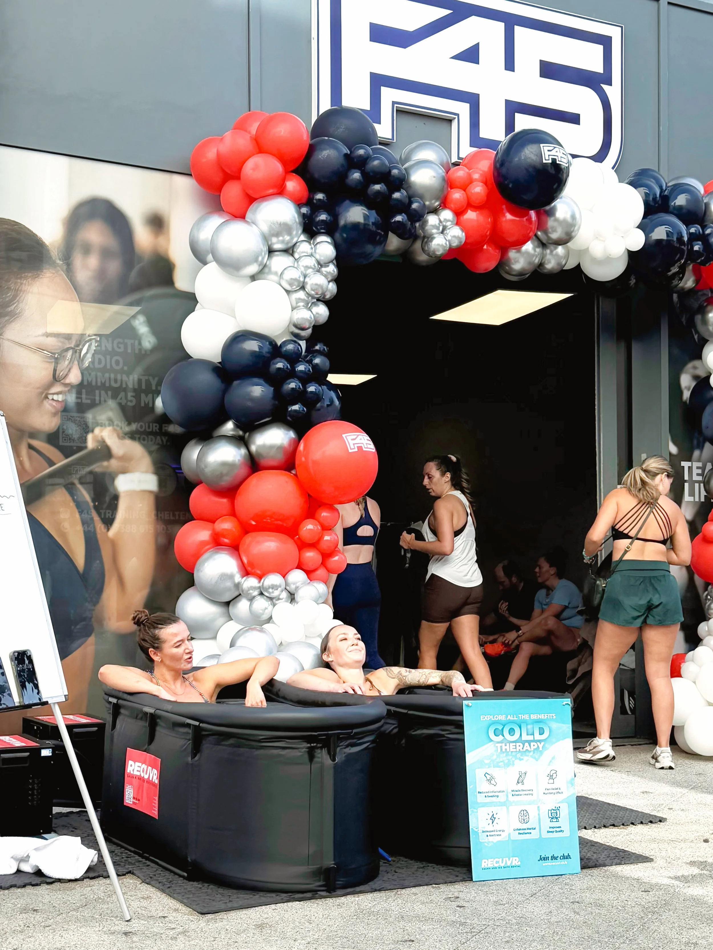 RECUVR mobile ice bath hire at F45 gym launch event helping members experience cold water therapy and post-workout recovery.