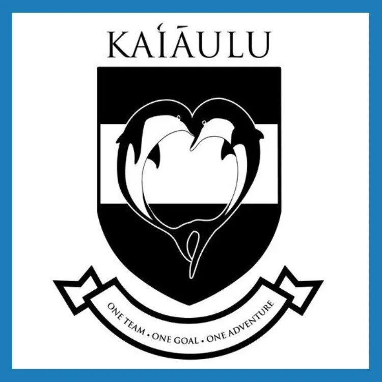 A black and white logo for Kaiâulu with two dolphins forming a heart shape, and a motto that reads 'One Team, One Goal, One Adventure'.