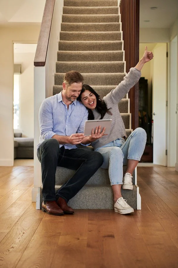 Happy homeowners who hired a professional moving company