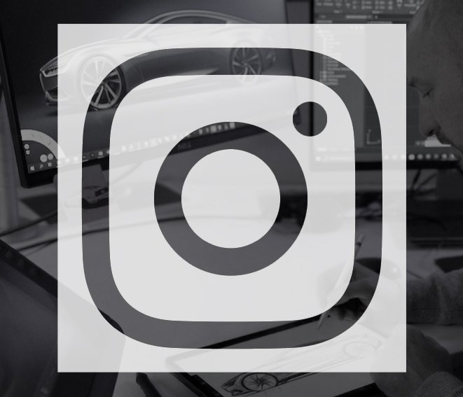 A person working on a computer with automotive design software displayed on the screen, showing 3D car models and digital dashboards.