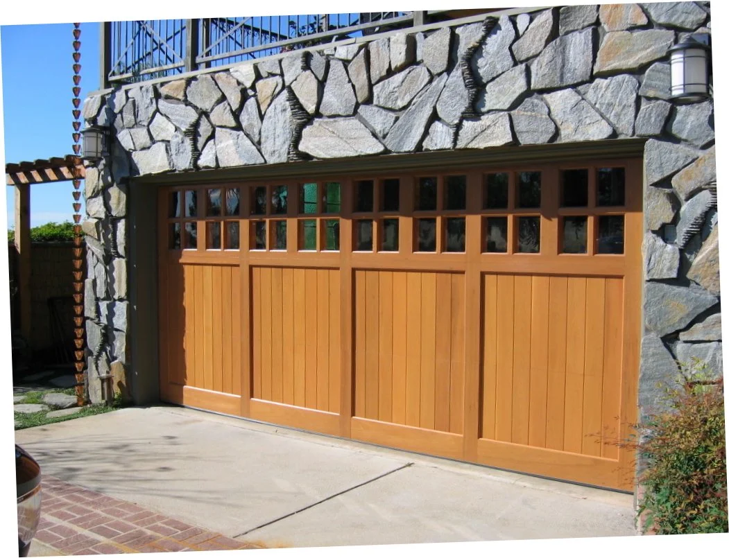 2 car garage door wood grain stone house