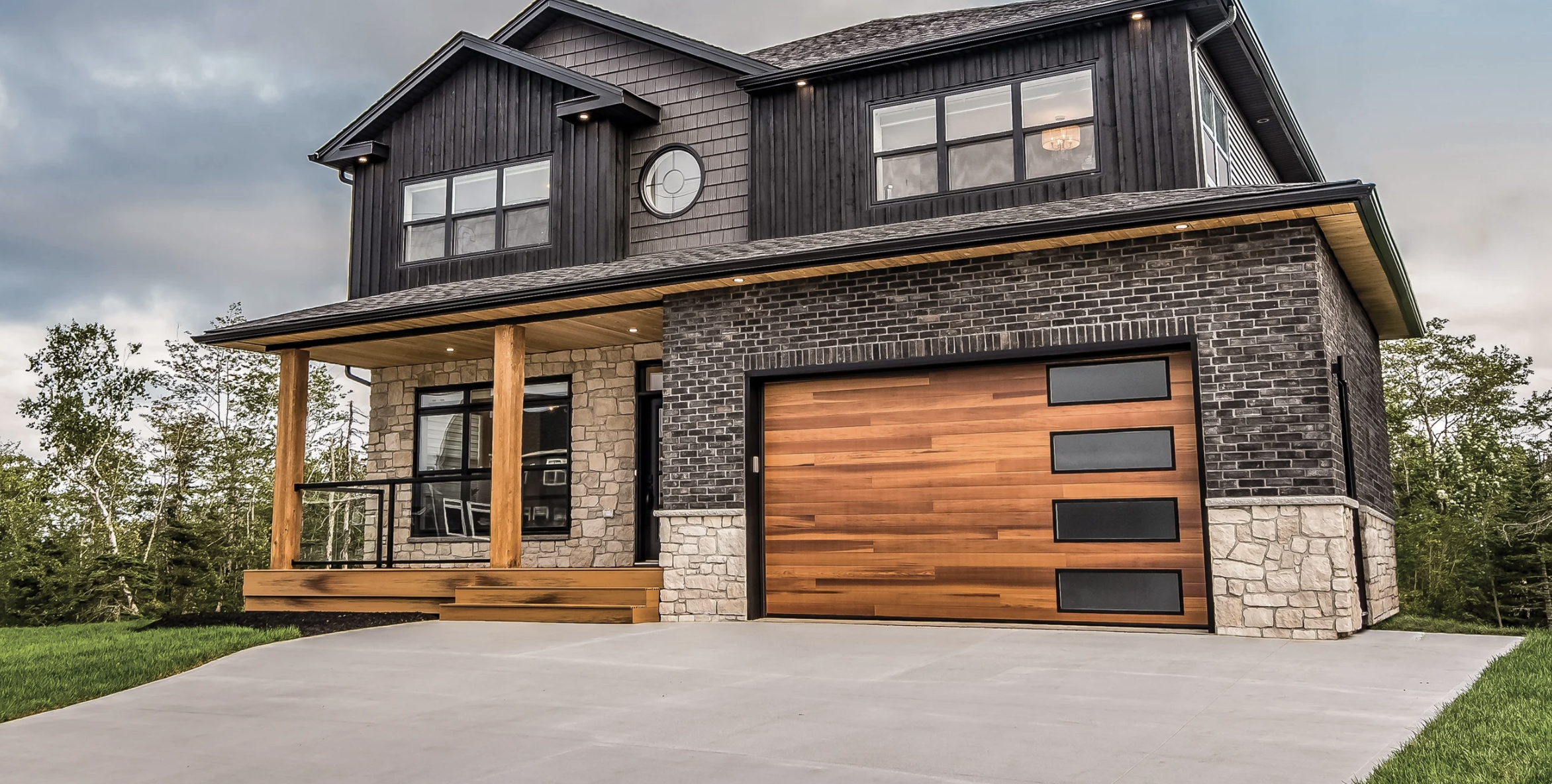 2 1 car wood grain garage doors with arched openings on cream stucco home