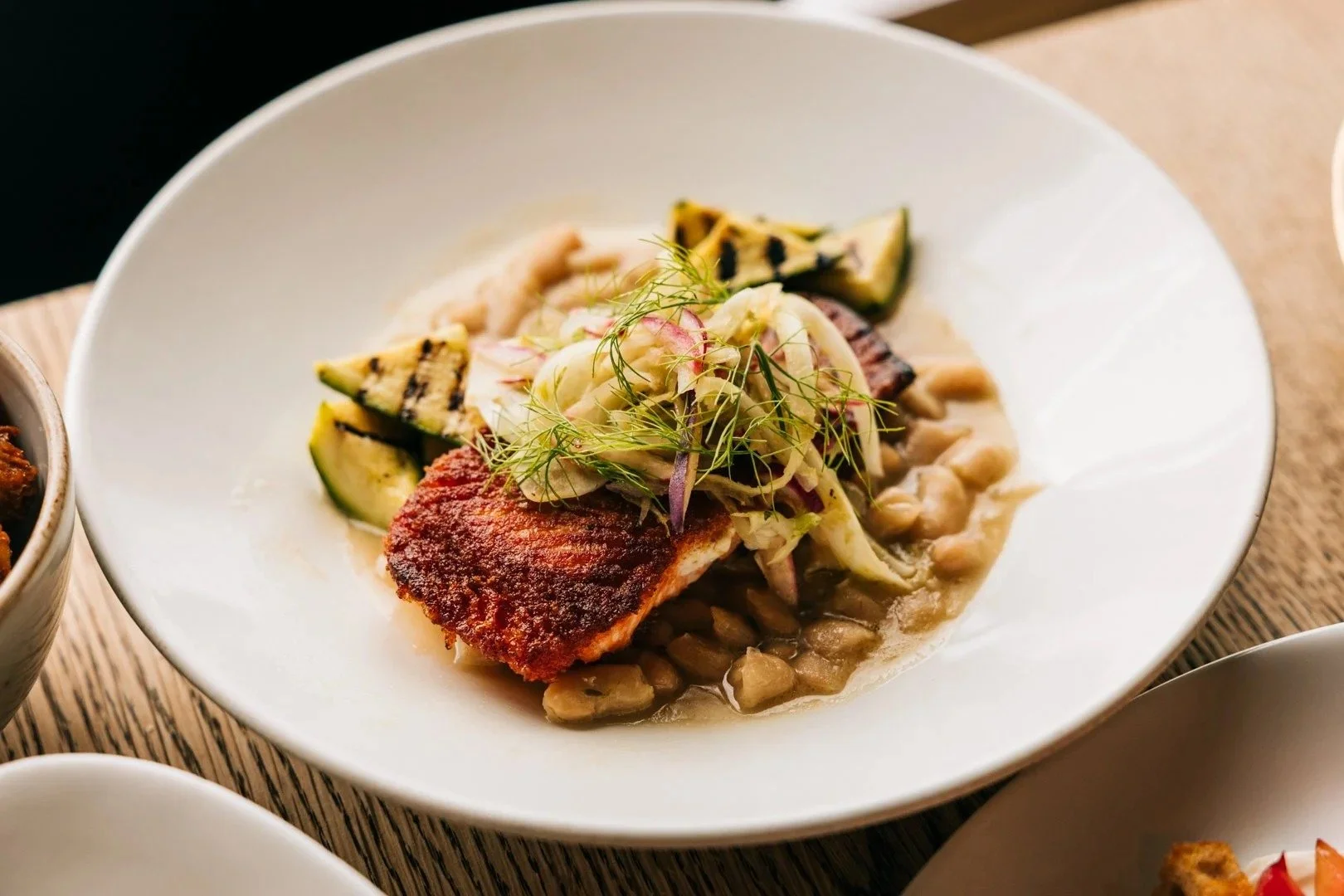 Pan seared fjord trout with cannellini beans and summer squash, seasonal fare in Chicago