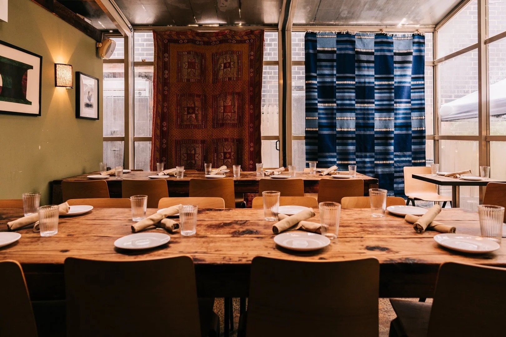 Long table set for group dinners and private events in Logan Square