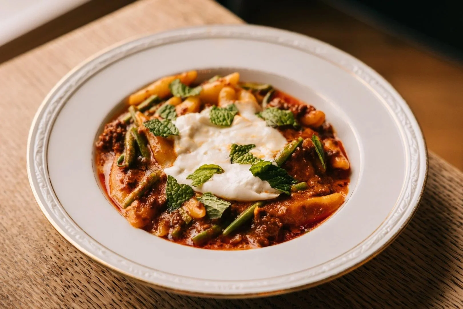 Ricotta gnocchi with piquillo pepper sauce and burrata in Logan Square