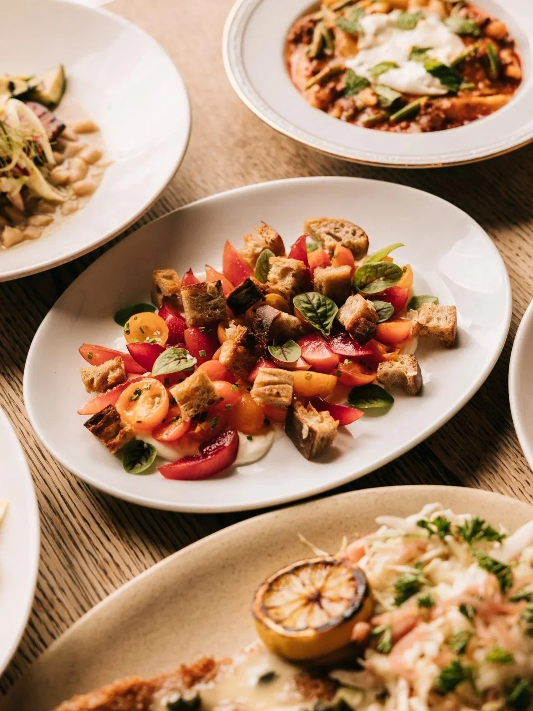 Sungold tomato salad with whipped feta and sourdough croutons