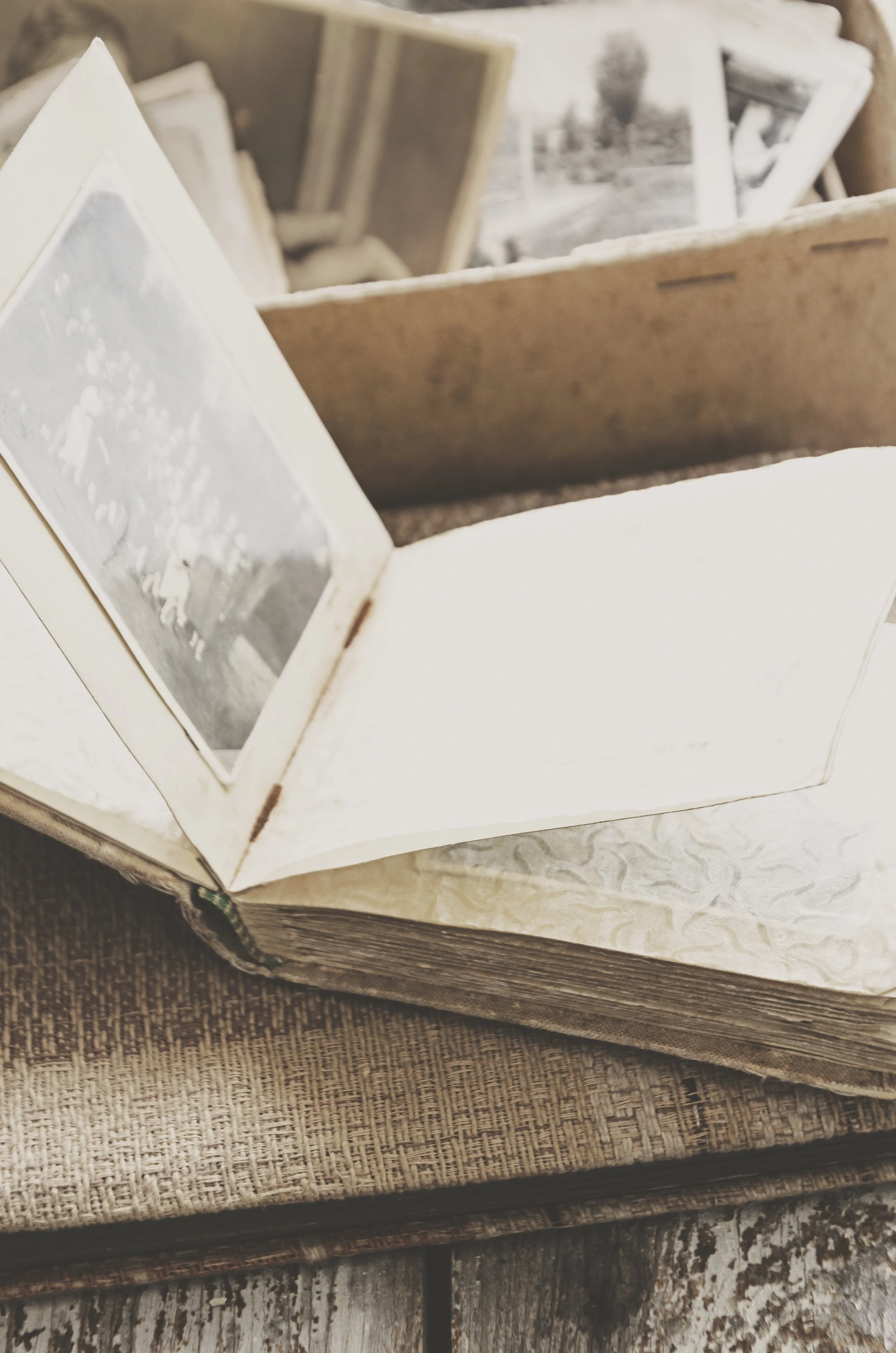 An antique box and book of photos.