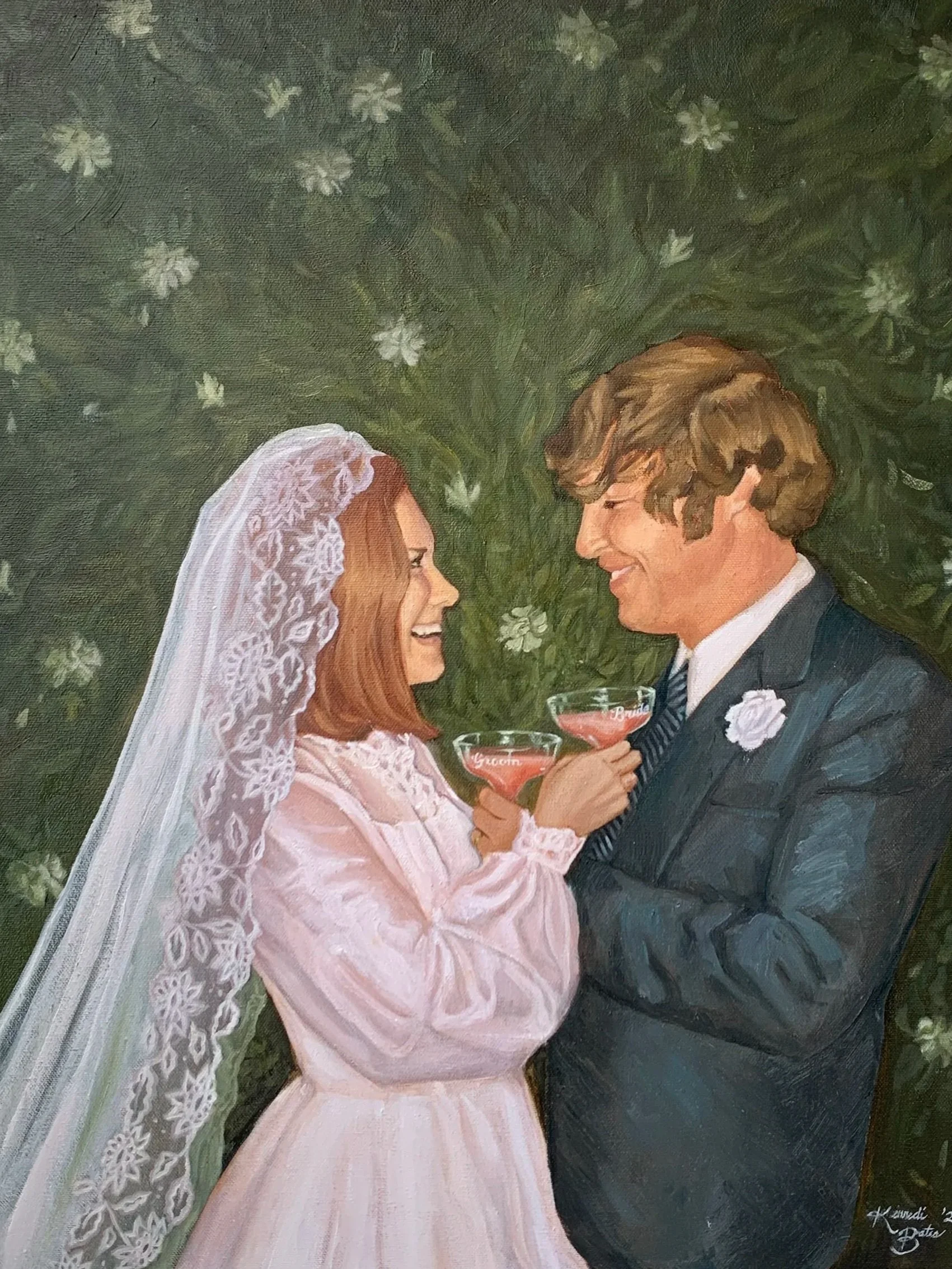 A painted wedding scene showing a bride and groom smiling at each other while holding cocktail glasses with pink liquid. The bride is wearing a white dress and lace veil, and the groom is in a dark suit with a white boutonniere. A green leafy backgro