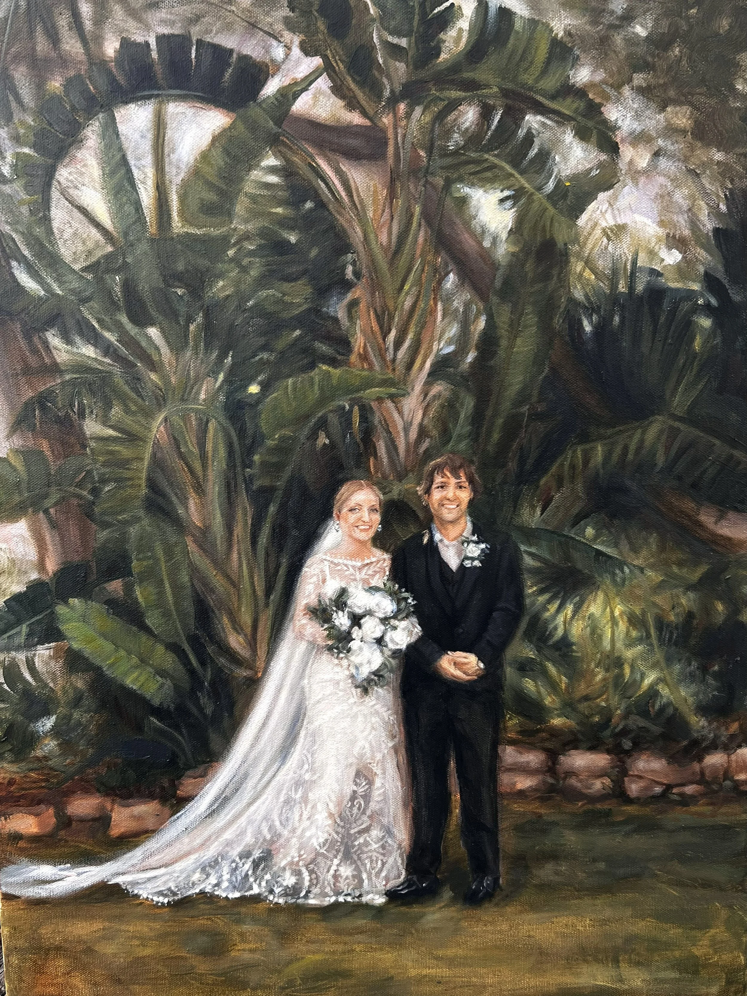 A wedding painting of a bride and groom standing together outdoors in front of large tropical plants. The bride is wearing a white lace wedding dress and holding a bouquet of white flowers. The groom is dressed in a black suit with a boutonniere.