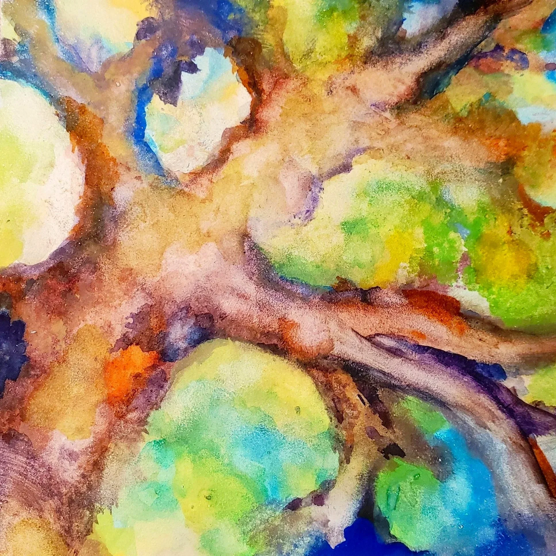 Abstract colorful watercolor painting with various shades of yellow, green, blue, orange, and purple blending seamlessly.