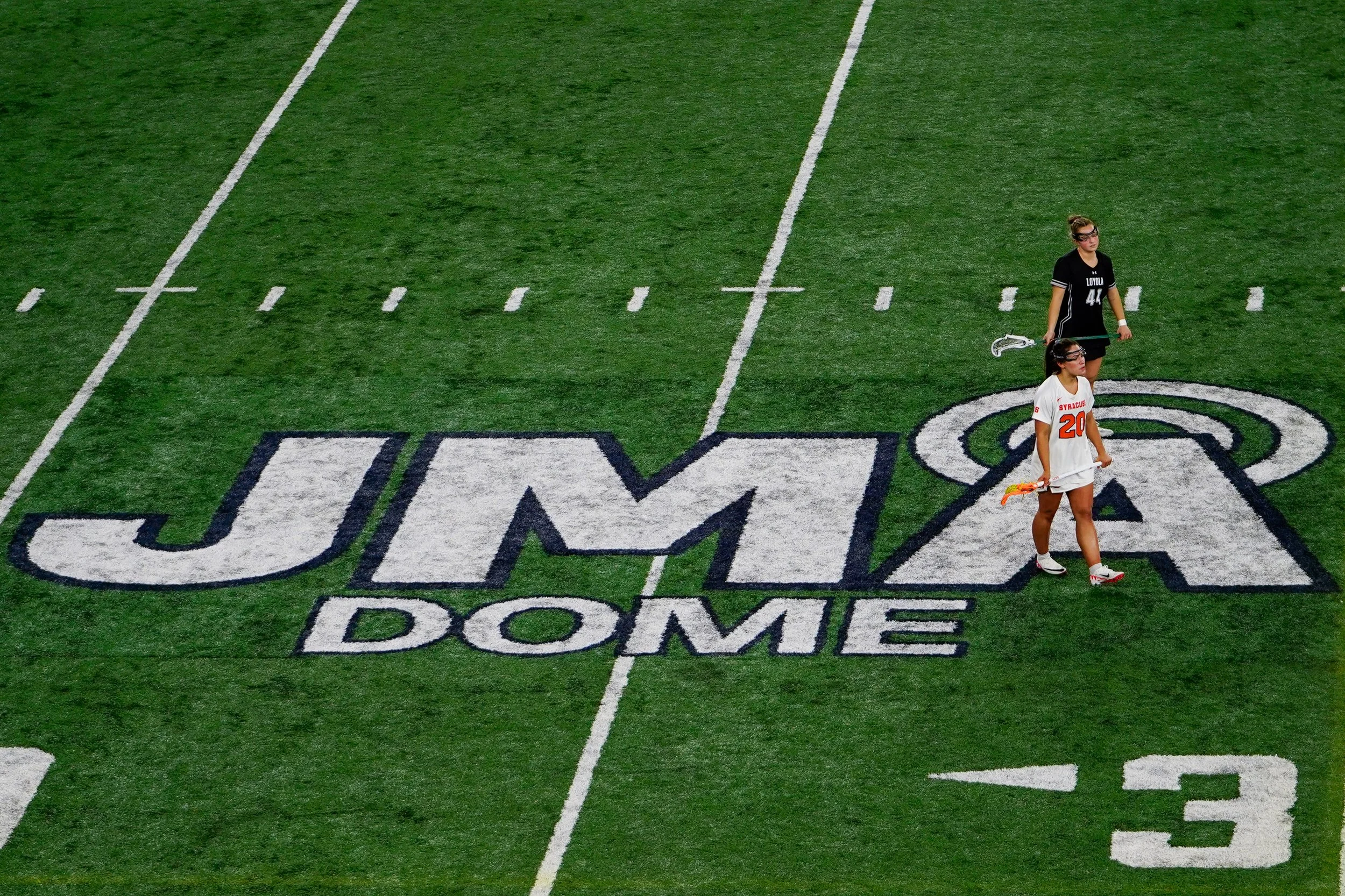 Syracuses Mackenzie Rich #20 playing womens lacrosse game against Loyola University Maryland in JMA Wireless Dome. Photo by Emily Hoban.