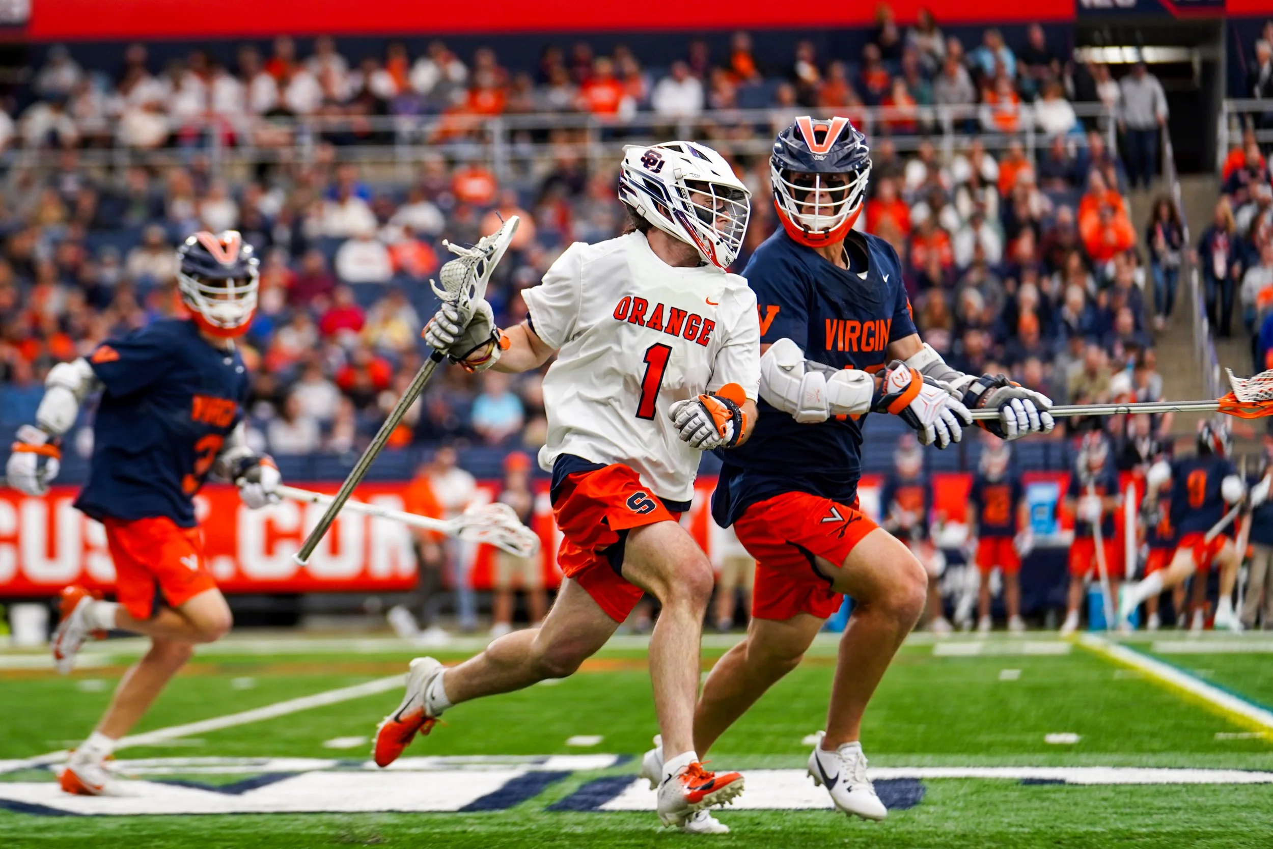 Syracuses Jake Spallina #1 travelling down the field during mens lacrosse game against University of Virginia in JMA Wireless Dome. Photo by Emily Hoban.