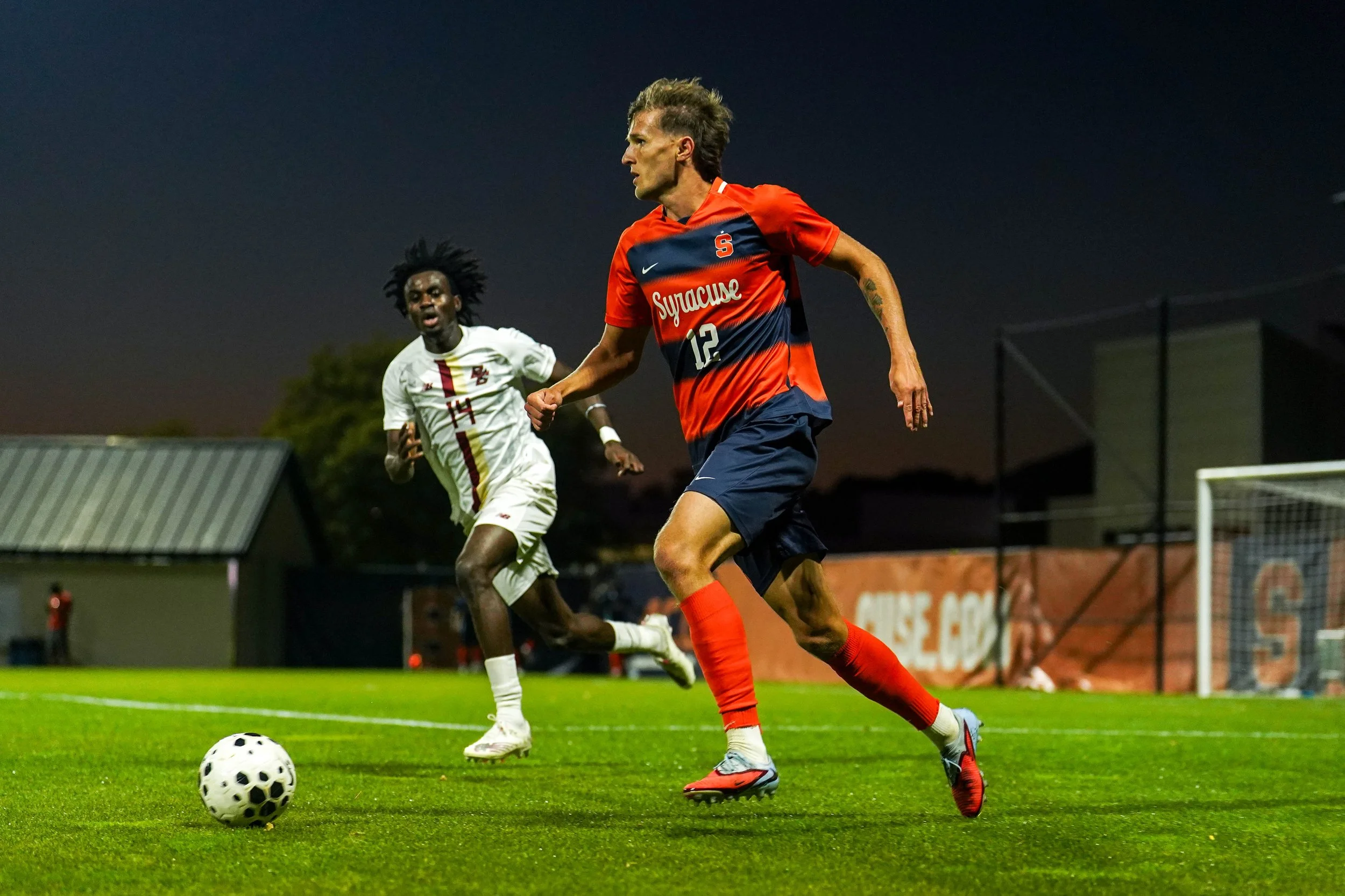 Syracuses Gavin Wigg #12 dribbing ball down the field during mens soccer game against Boston College at SU Soccer Stadium. Photo by Emily Hoban.