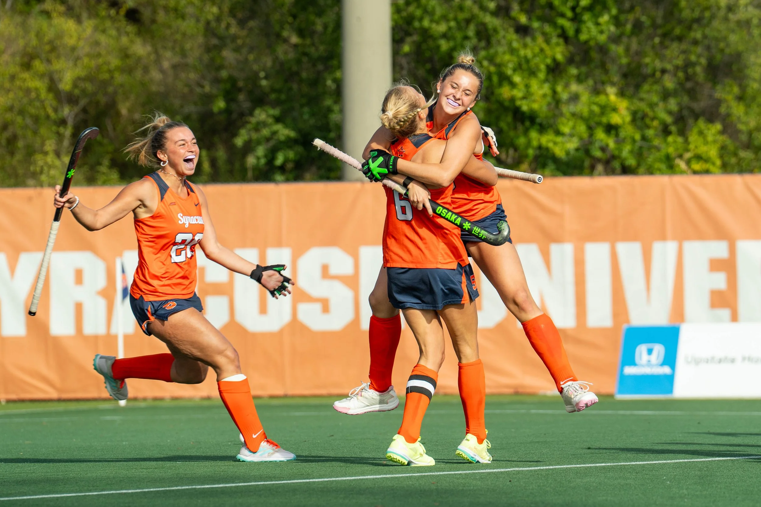 Syracuse field hockey celebrating goal against University of North Carolina at J. Stanley Coyne Stadium. Photo by Emily Hoban.