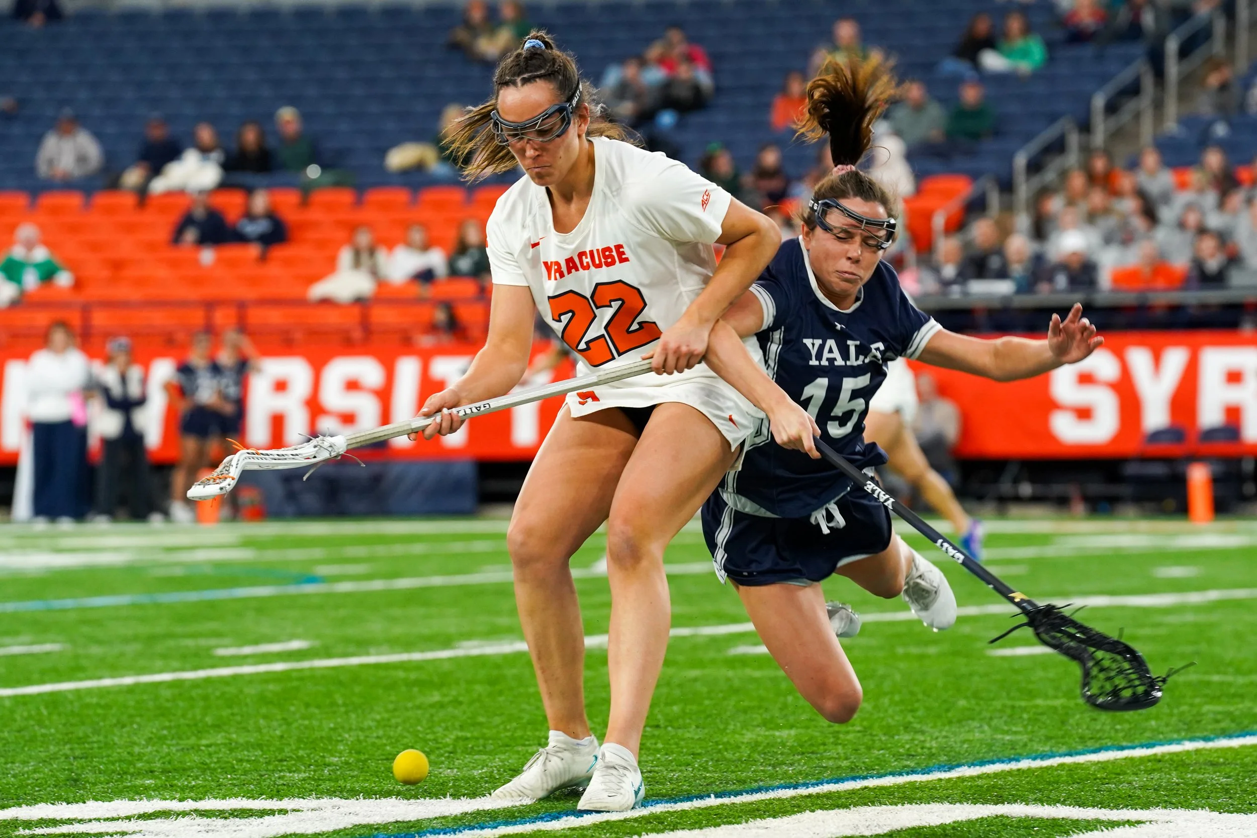 Syracuses Molly Guzik #22 chasing down ball during game against Yale University in JMA Wireless Dome.