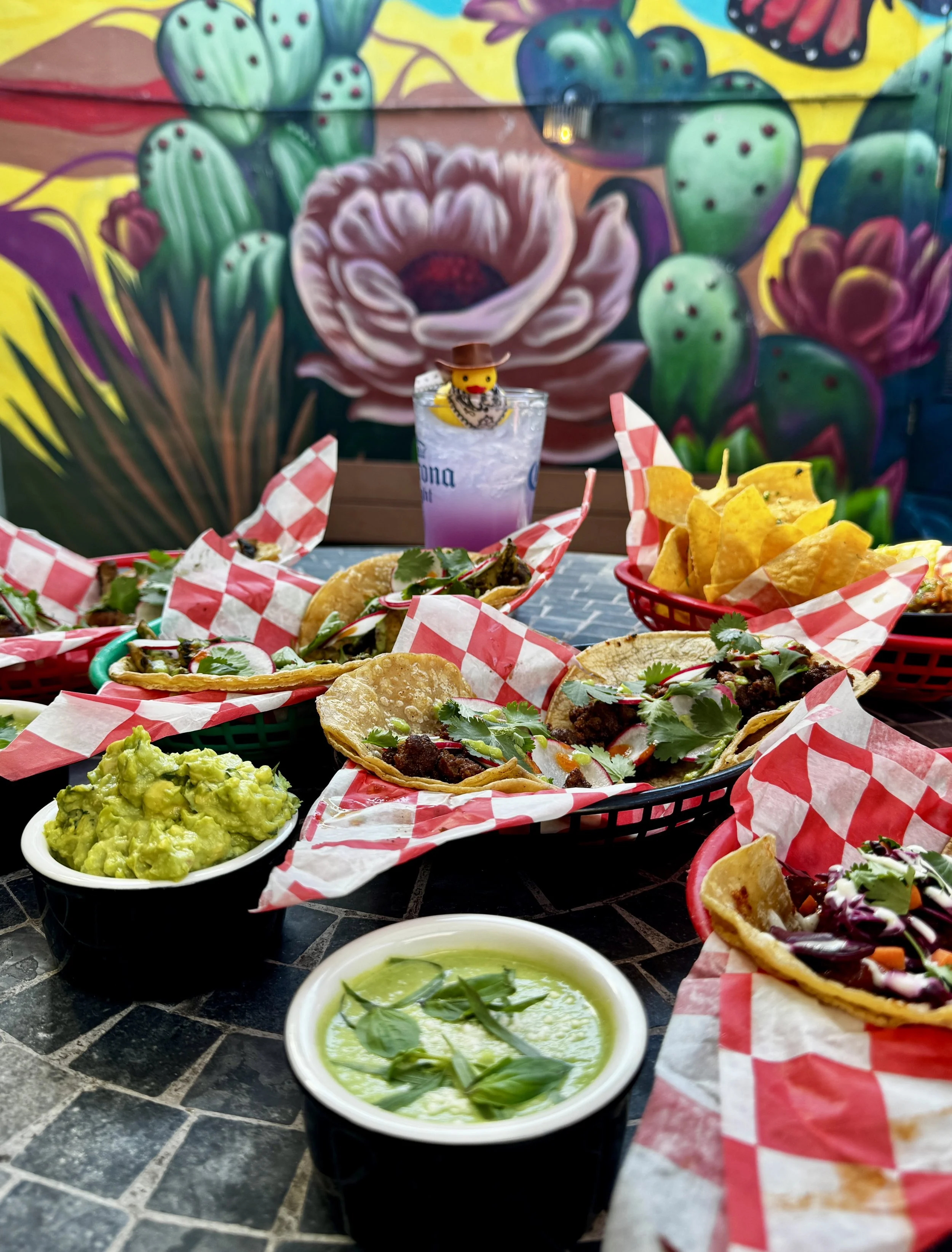 A feast of tacos and guacamole and chip with cocktails perfect for a group or a party on U Street DC