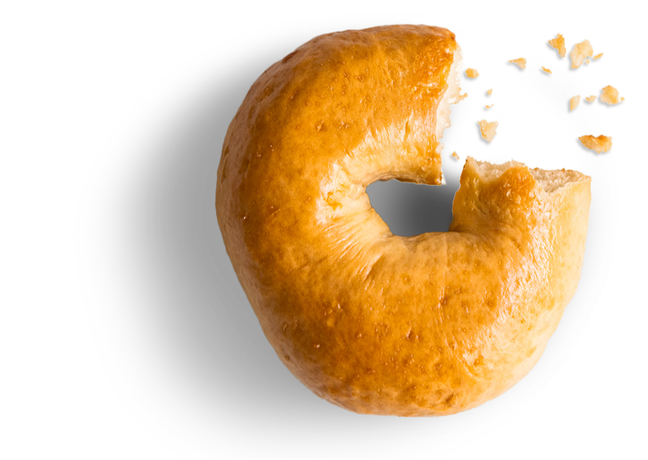 A Ziggy's Bakehouse Bagel with a comical bite taken out of it, showing how great tasting they are.