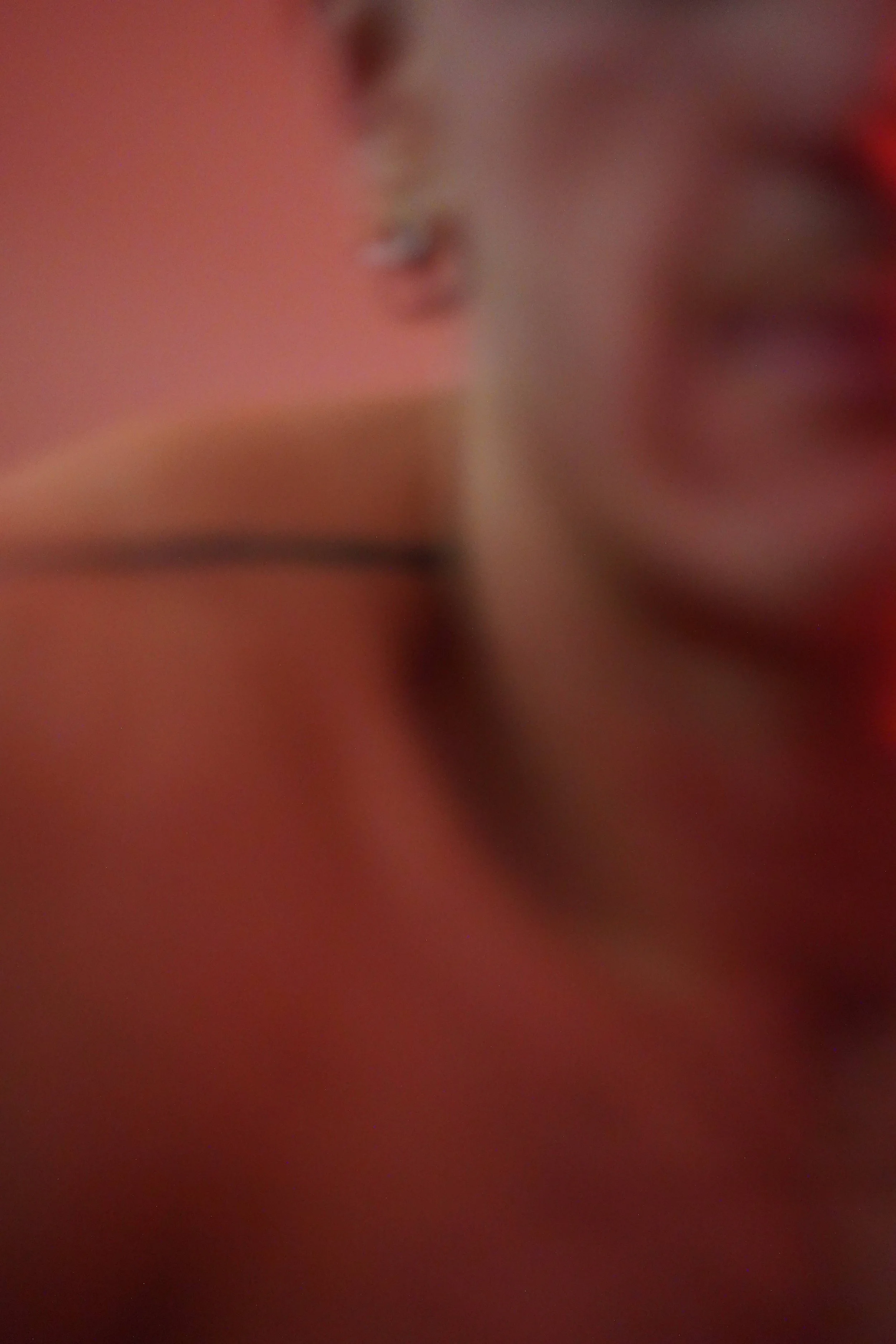 Close-up image that appears blurry and out of focus, with indistinct shapes and colors.