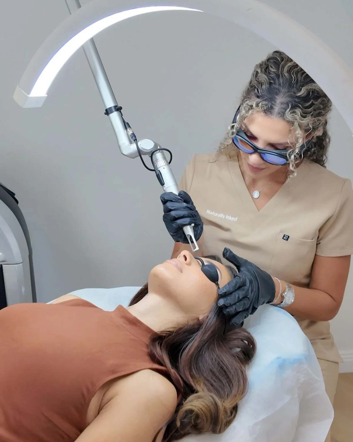 Provider performing a Fotona laser facial treatment at PHI Skin Clinic in Vancouver