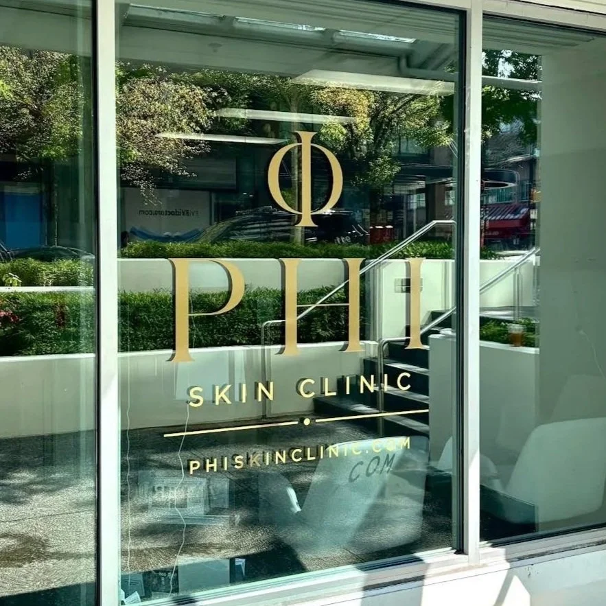 Phi Skin Clinic storefront in Vancouver with gold window signage