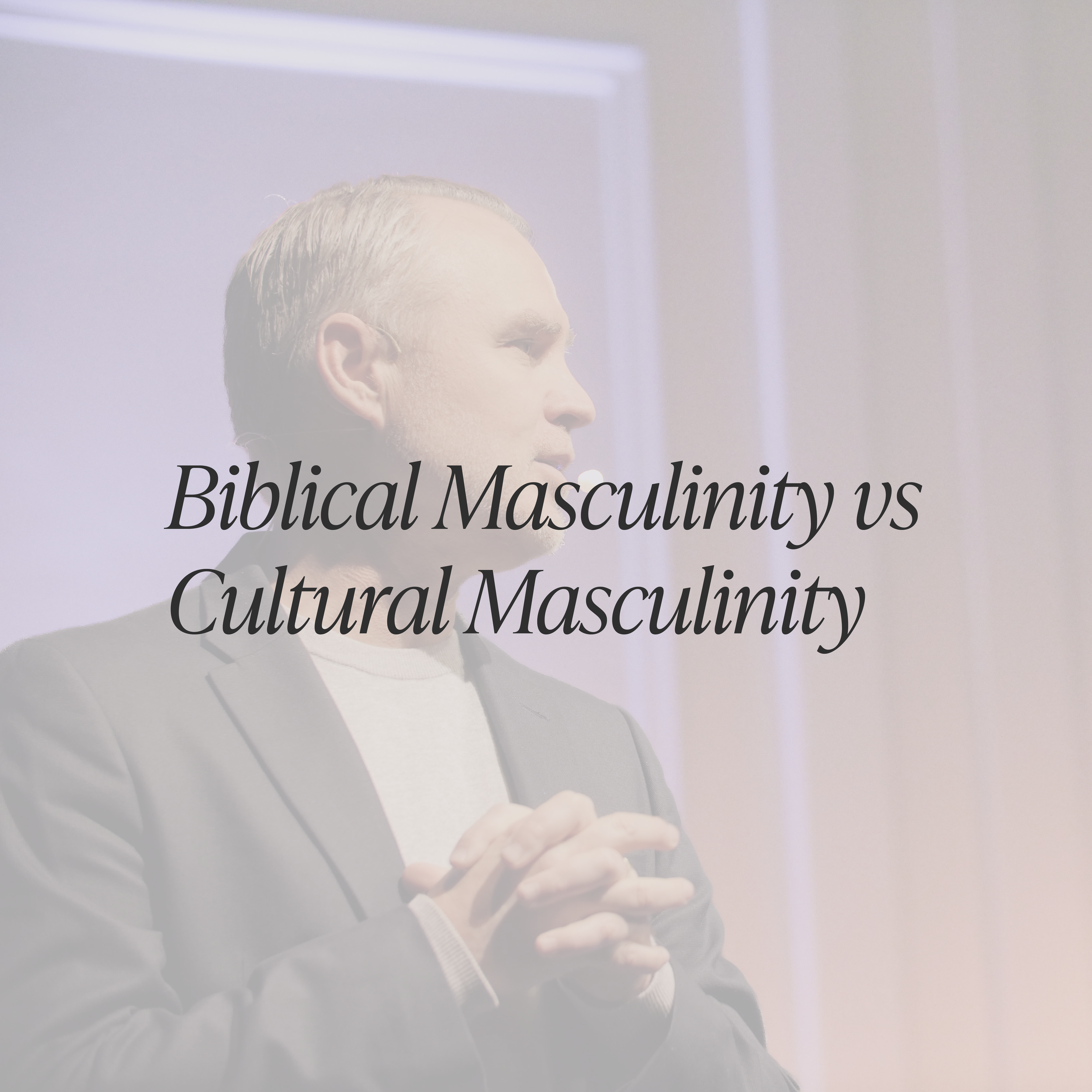 Close-up of a person with blond hair, wearing a dark suit and white shirt, with text overlay that reads 'Biblical Masculinity vs Cultural Masculinity'.