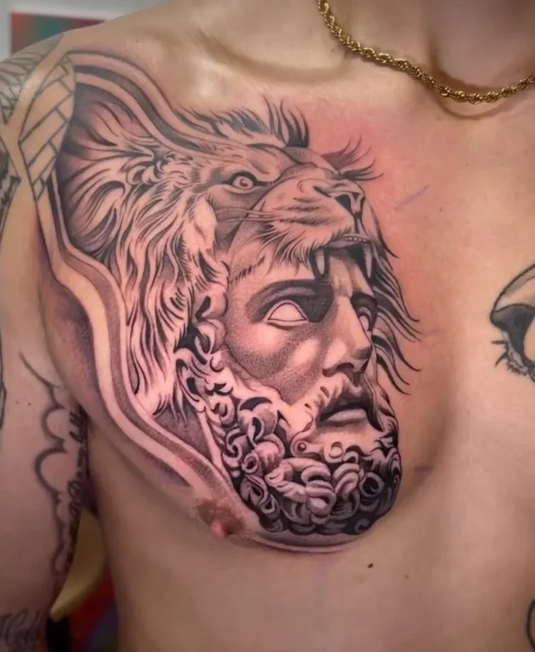 Tattoo of a lion's head and a classical statue face on a person's chest.