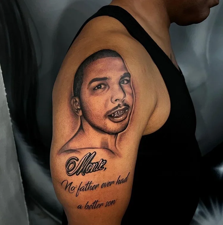 Tattoo of a young man's face with a gold grill smile and a short haircut, with text underneath reading: "Montz, No father ever had a better son."