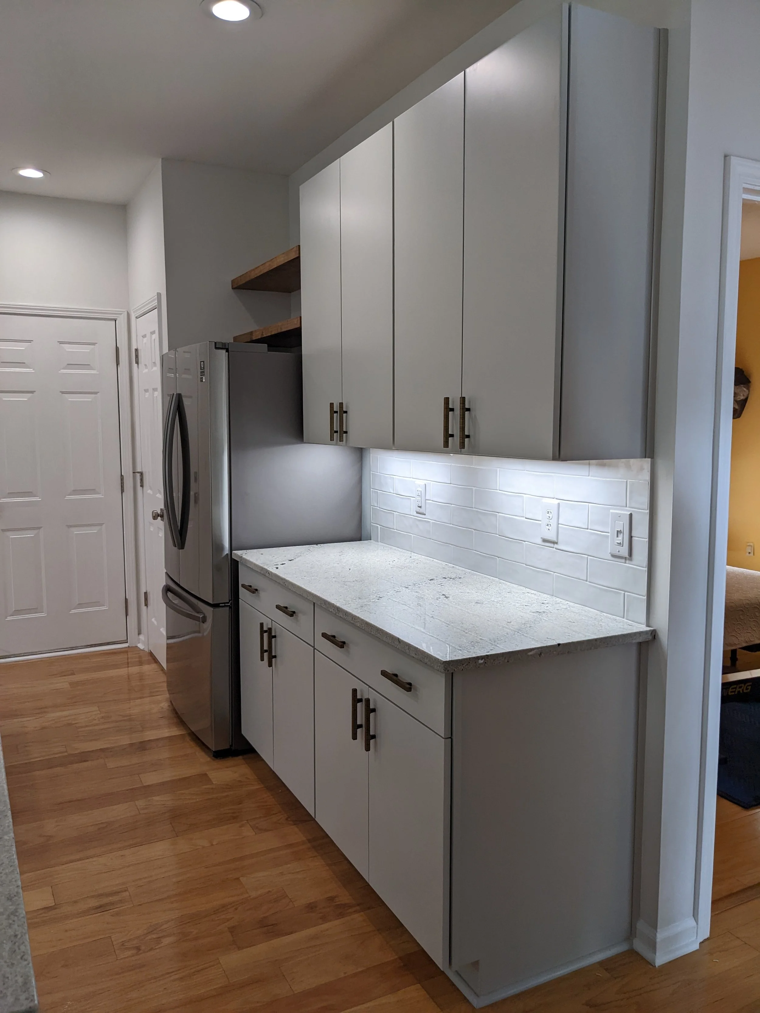Charlotte Kitchen, European Style Cabinets, Modern Design, Under Cabinet Lighting, Quartz Countertop, Floating Shelves.