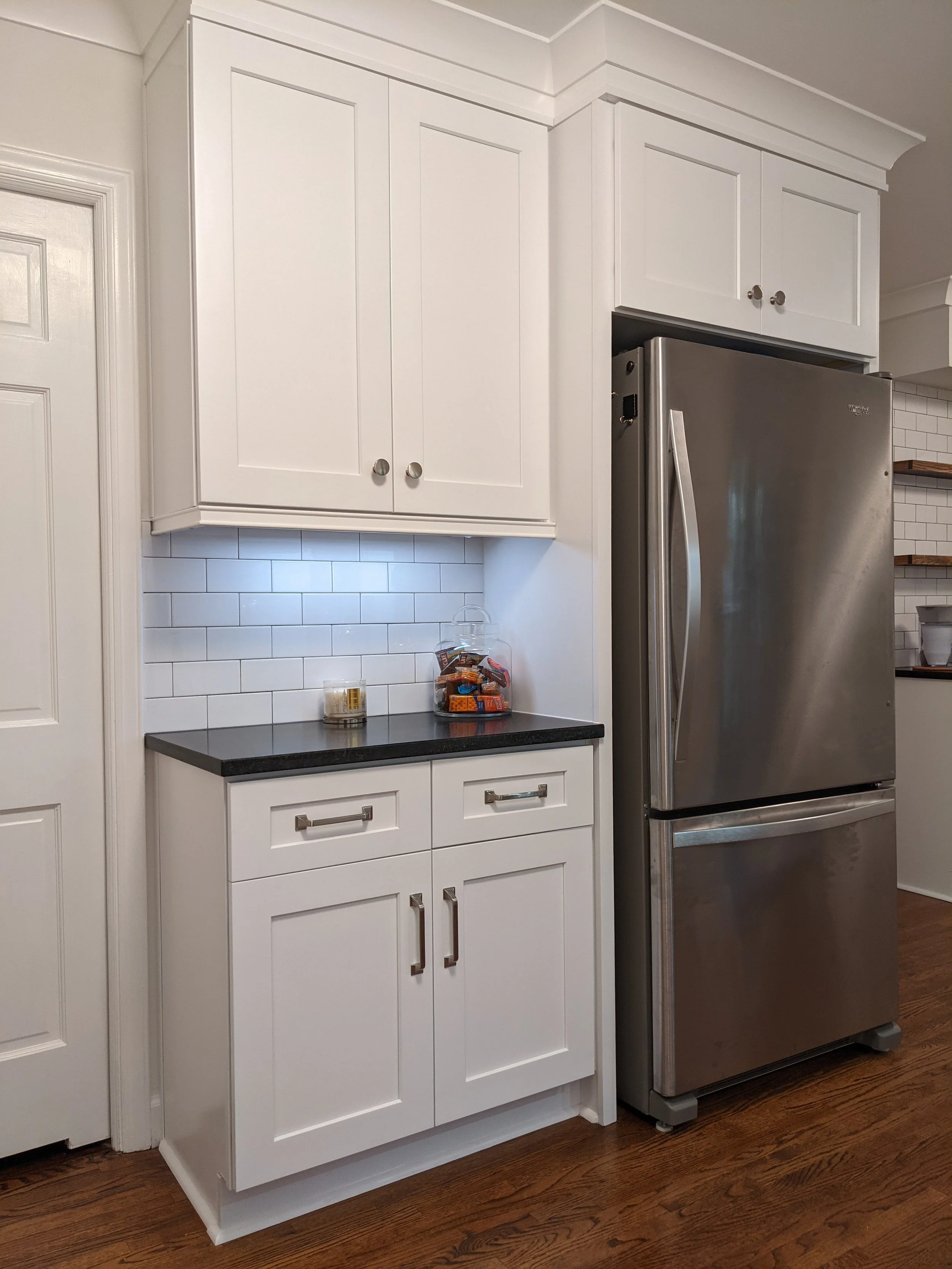 Gate Post Kitchen Fridge Enclosure, White Shaker Cabinets, Quartz Countertop, Subway Tile Backsplash, Under Cabinet Lighting