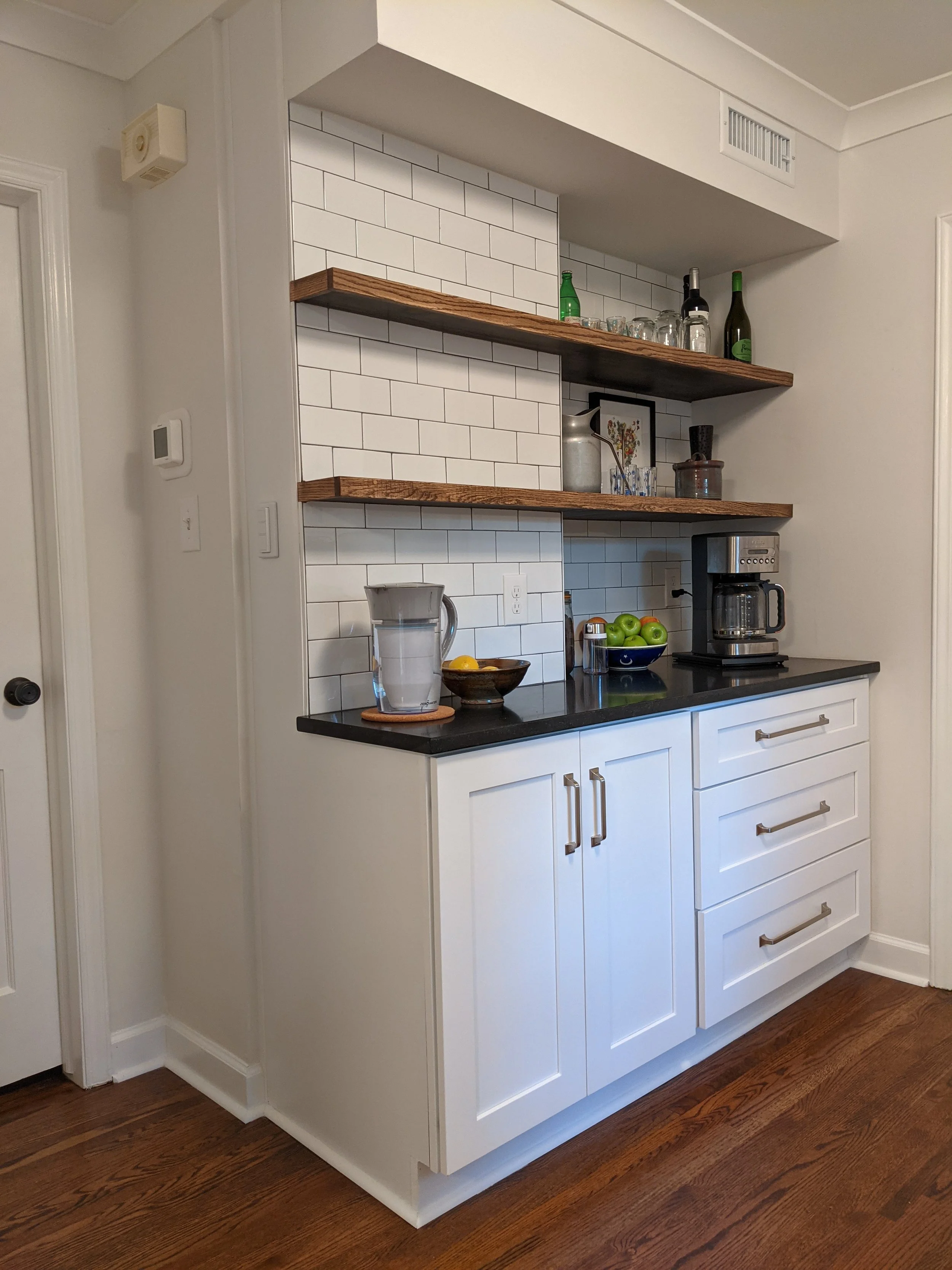 Gate Post Coffee Bar, White Shaker, Custom Floating Shelves, Quartz Countertop, Subway Tile Backsplash.