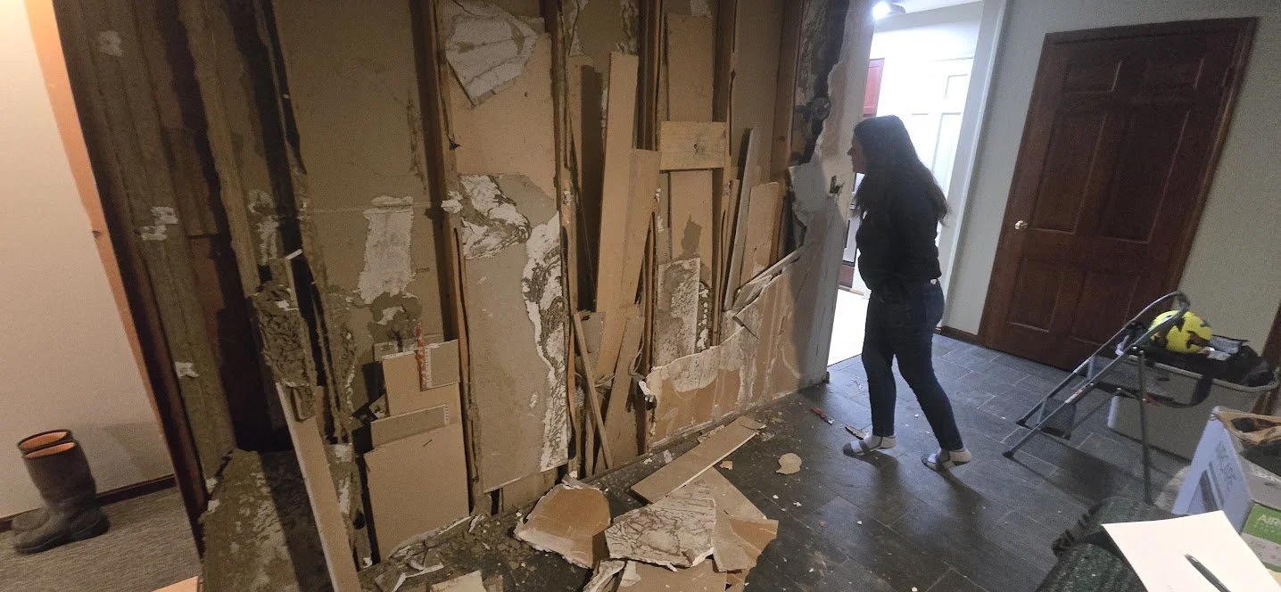 interior_wall_exposed_framing_and_drywall_damage.jpg