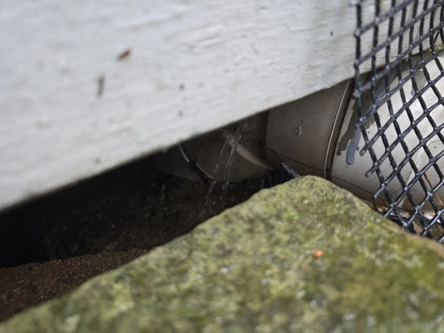 active_water_leak_under_deck_drain_line.jpg