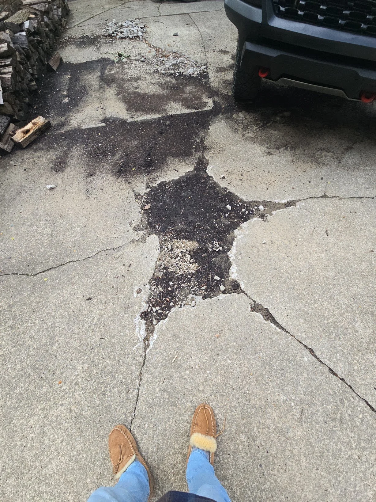 driveway_cracked_deteriorated_concrete_asphalt_patch.jpg