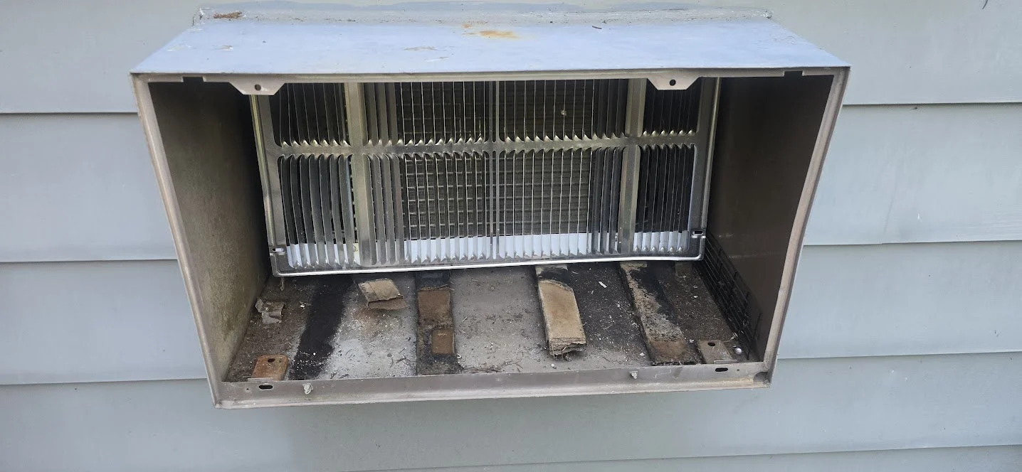 wall_ac_unit_improper_cardboard_shims_overview_03.jpg