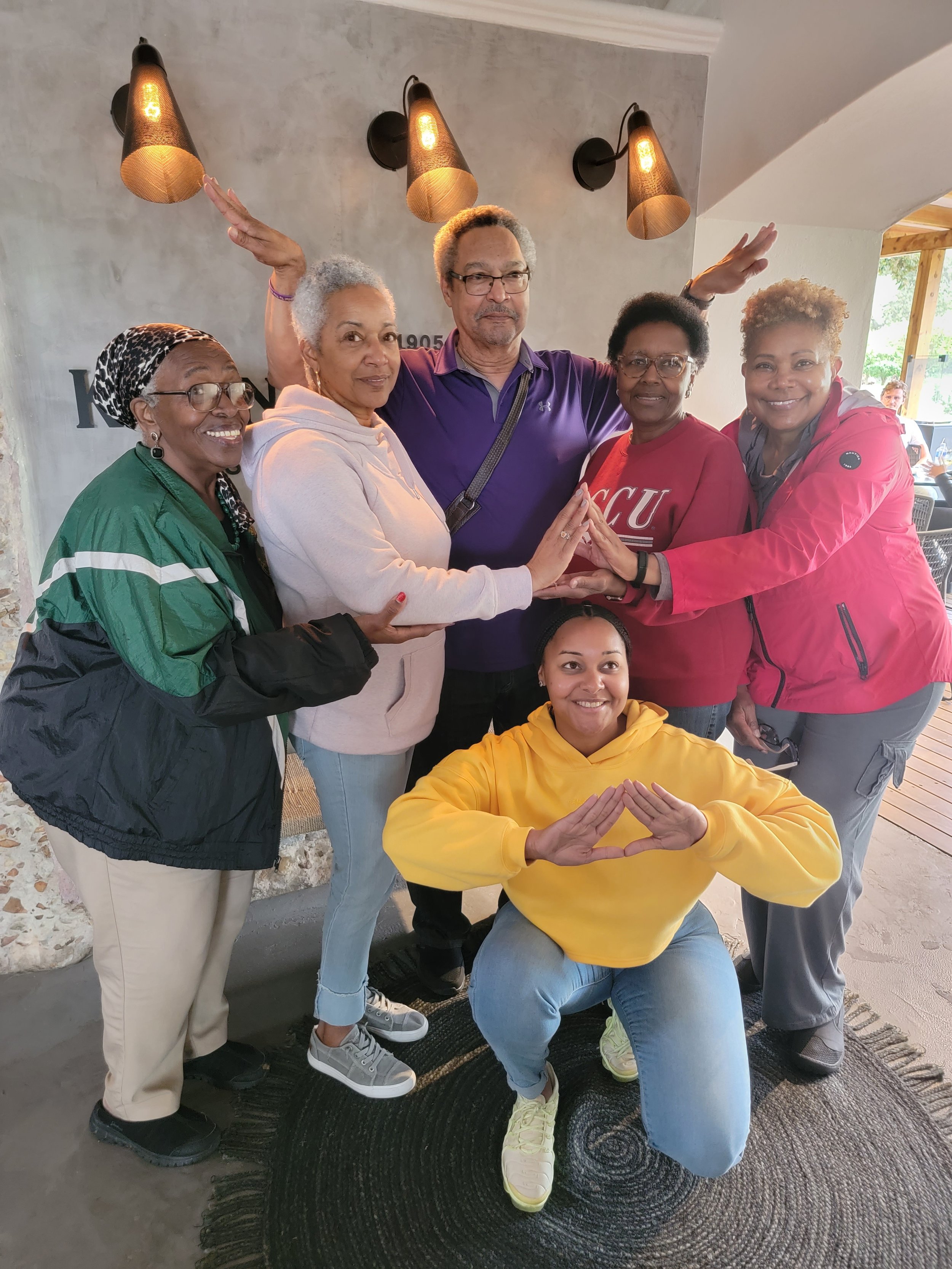 Group photo with six Sorors and one member of Omega Psi Phi Fraternity Inc.