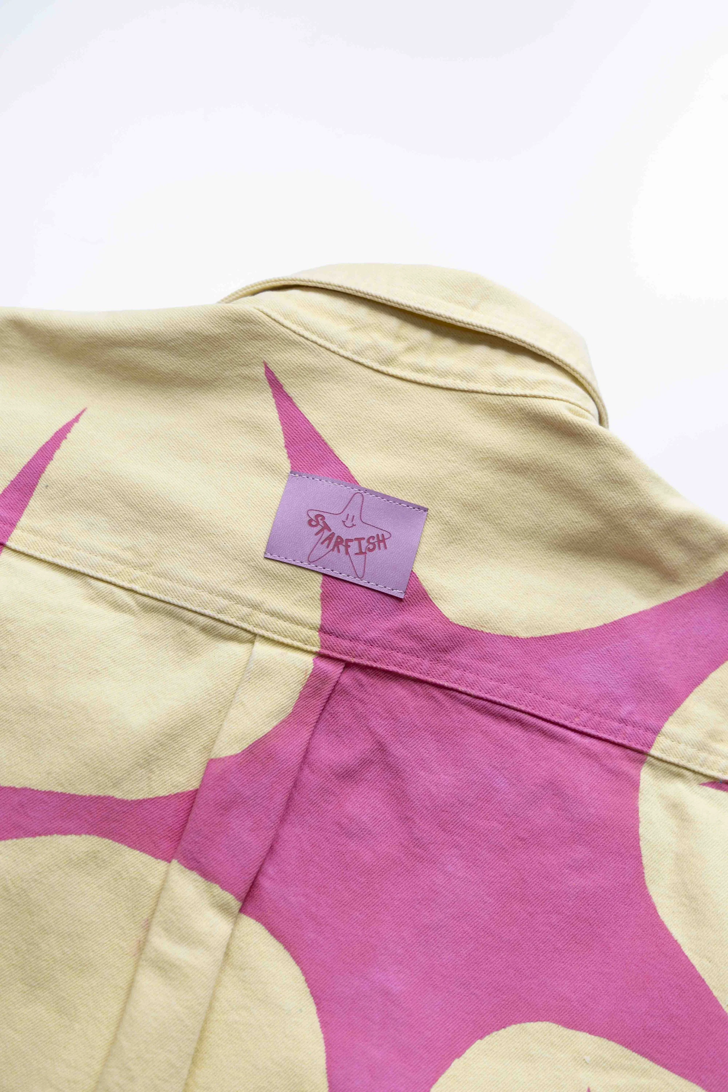 Yellow denim shirt with hand painted pink stars detail view / Starfish the First / Paris