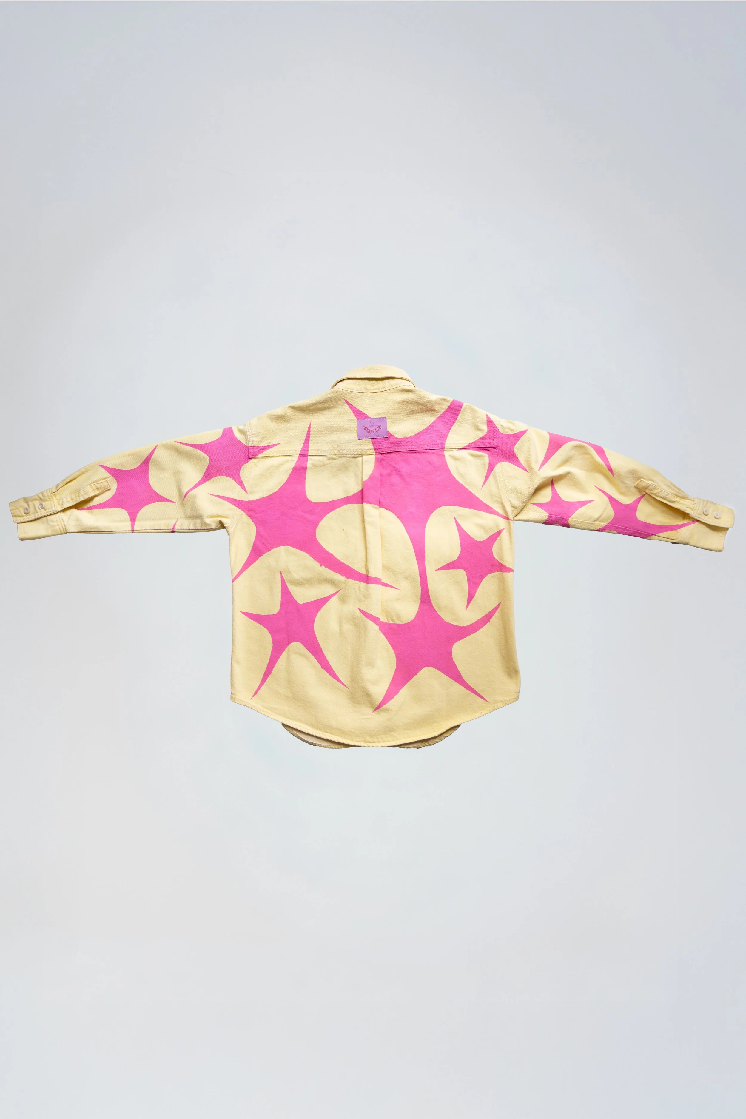 Yellow denim shirt with hand painted pink stars back view / Starfish the First / Paris