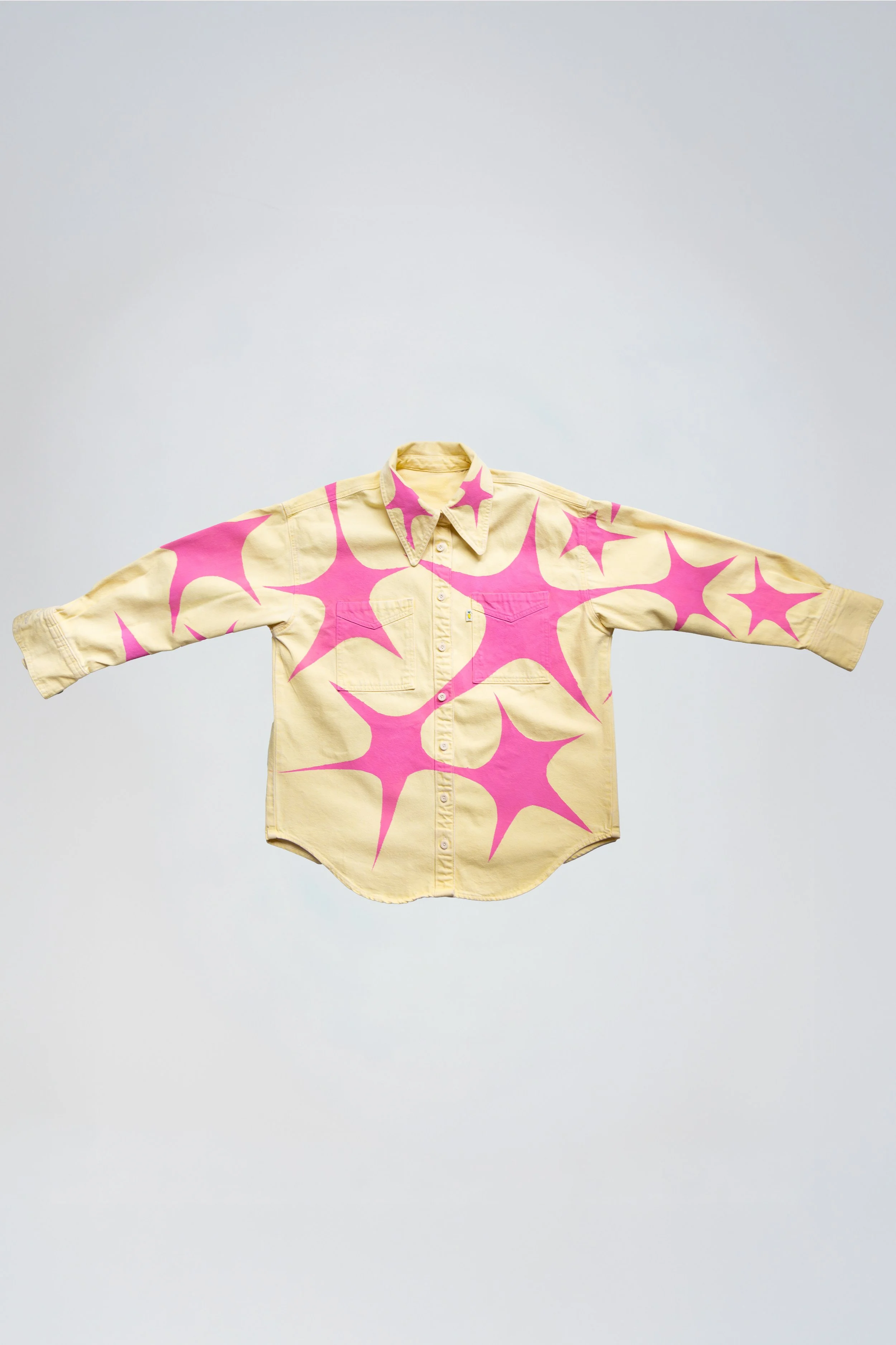 Yellow denim shirt with hand painted pink stars front view / Starfish the First / Paris