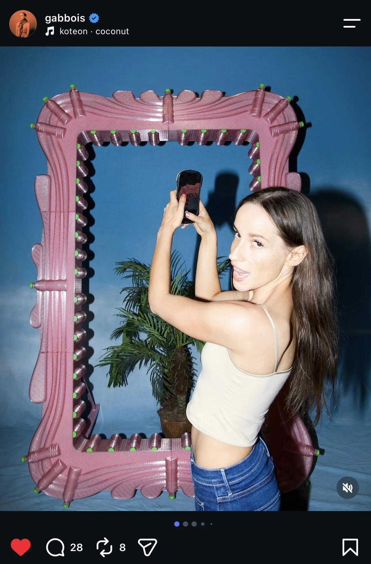 Gabbois Posing with Pink Bottle Art Installation