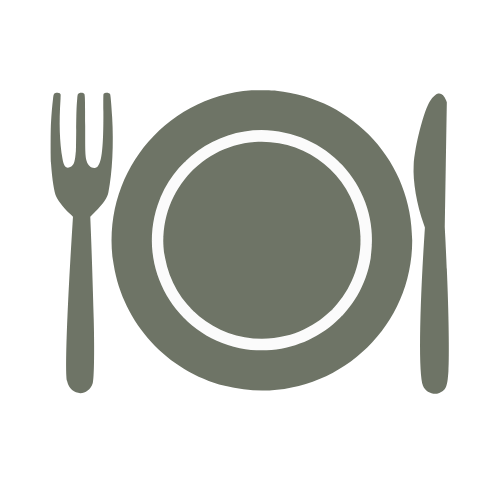 Plate with fork on the left and knife on the right, on a dark background.