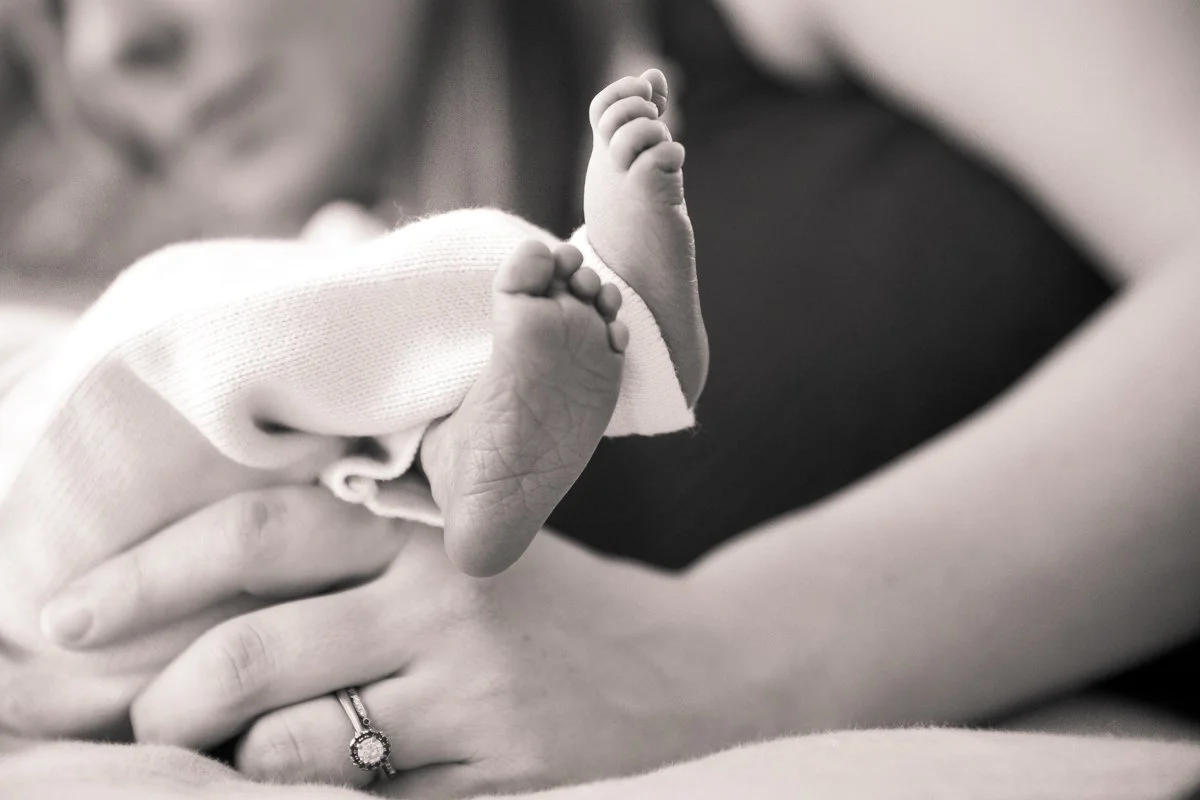 Authentic body positive newborn portrait capturing real connection and love in Durham, NC