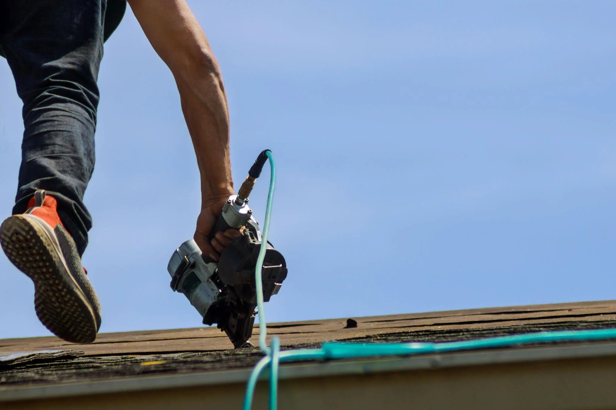 Roofing contractor on roof