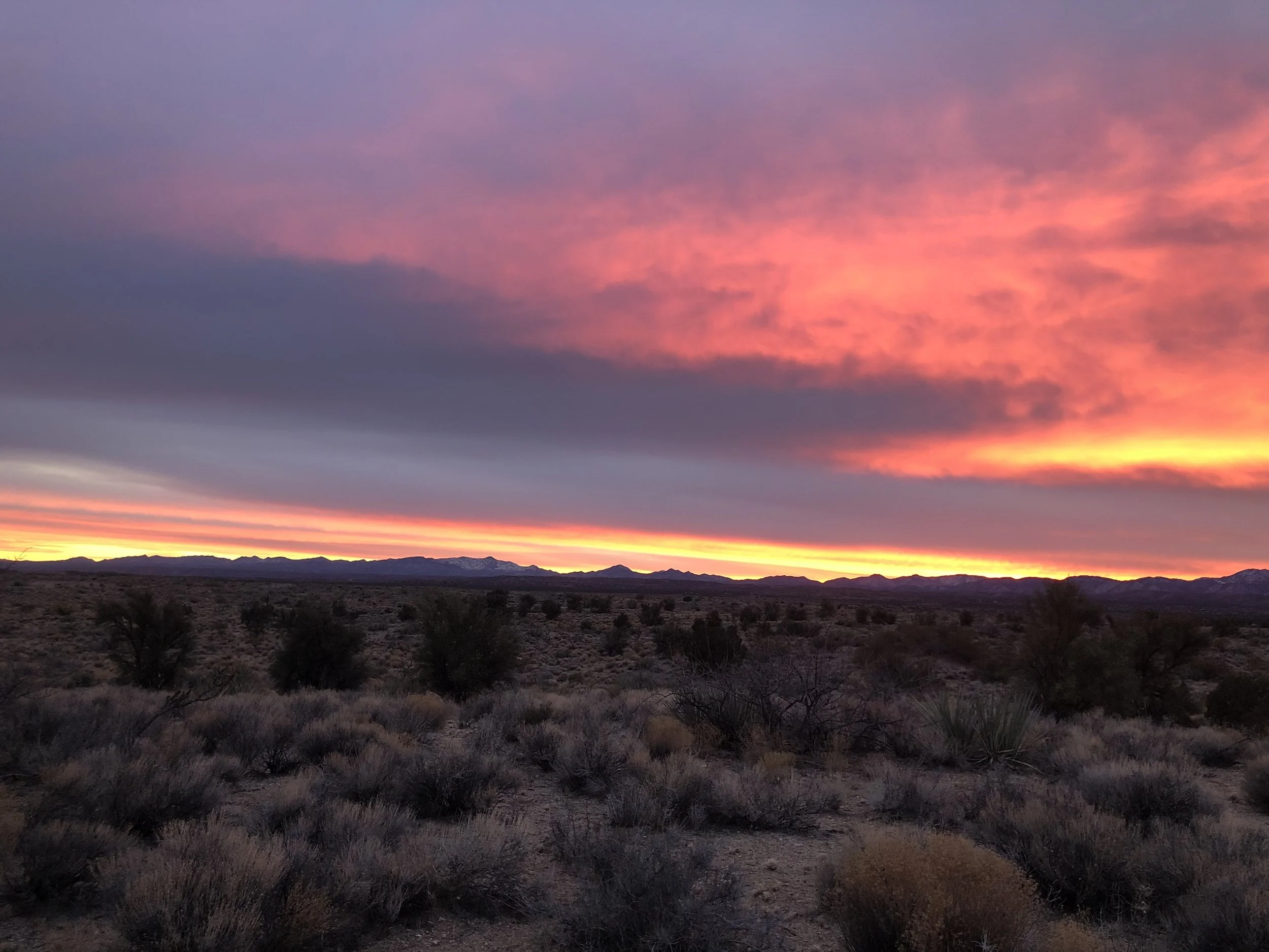 Colorful sunset over the Arizona desert near The Butterfly Alchemy private retreat.