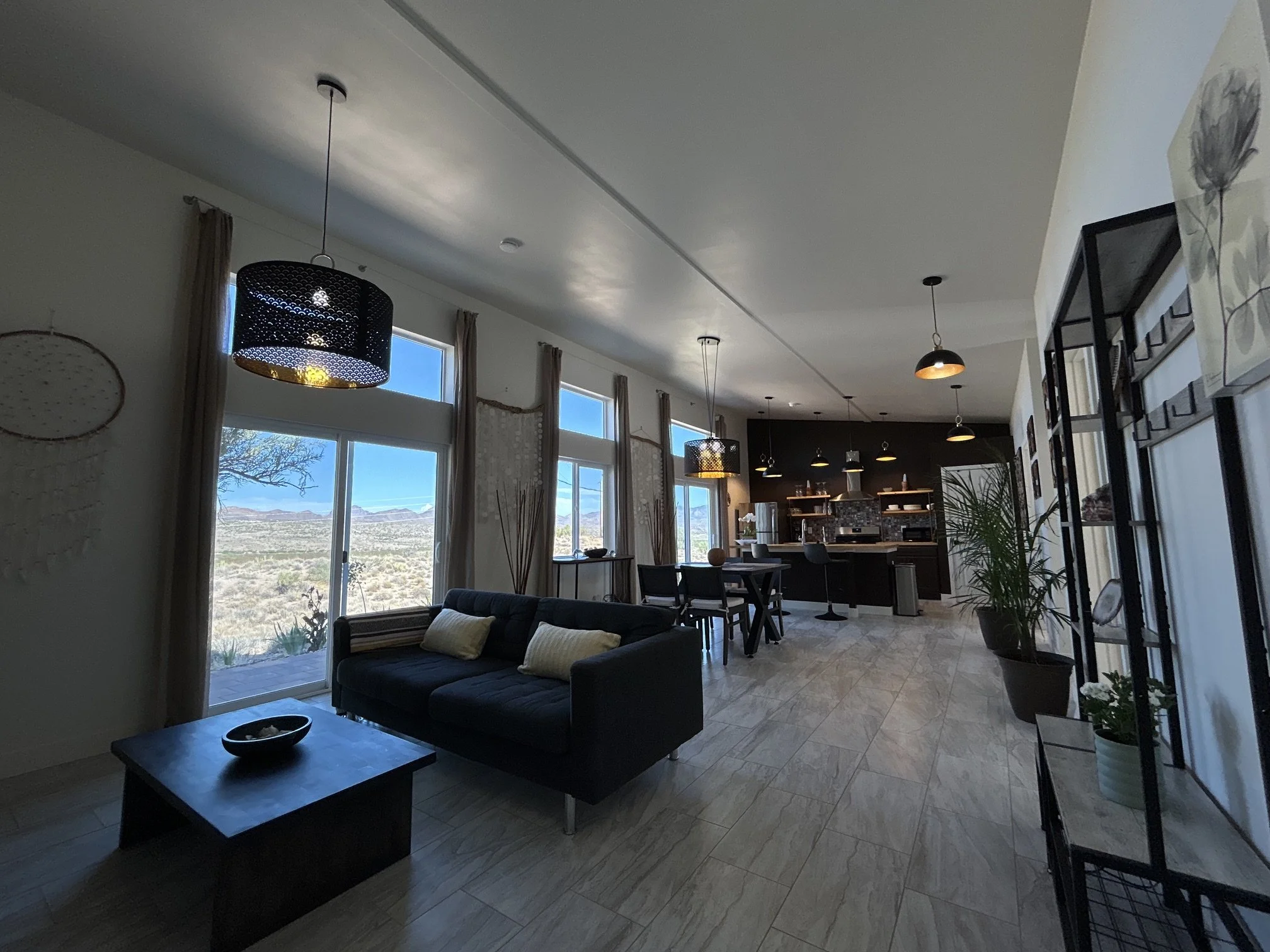 Open living and dining space overlooking the Arizona desert at The Butterfly Alchemy retreat.