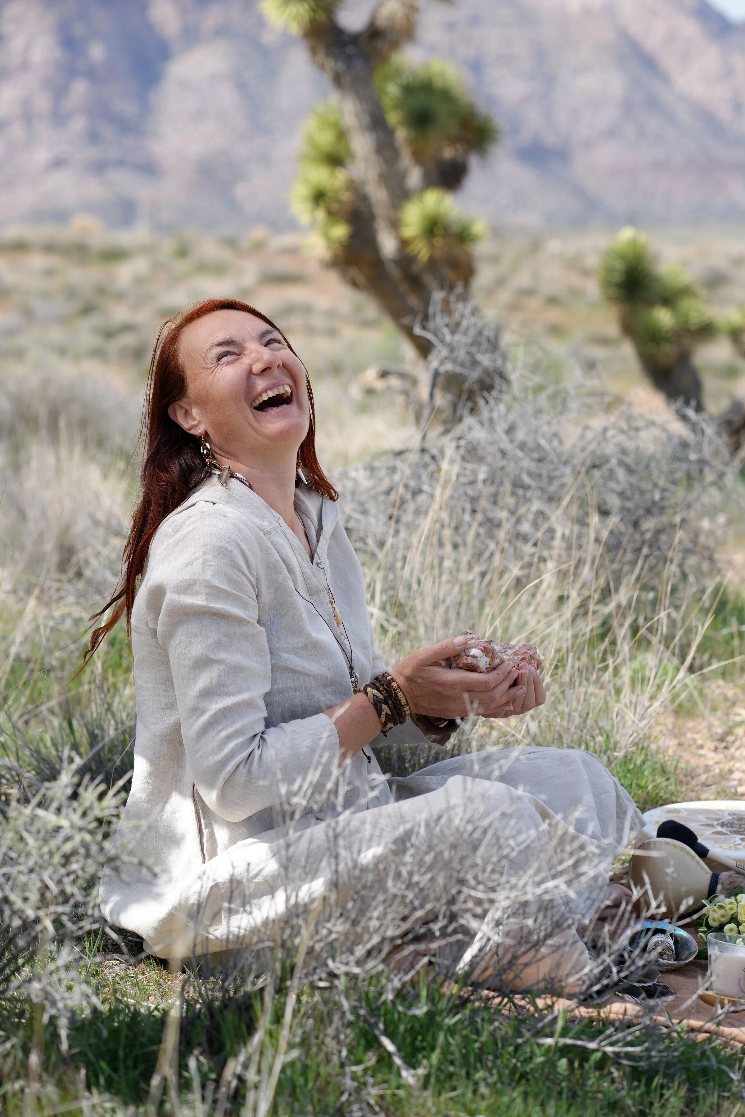 Silviya Doneva connecting with nature and holding a crystal during a personal transformation journey