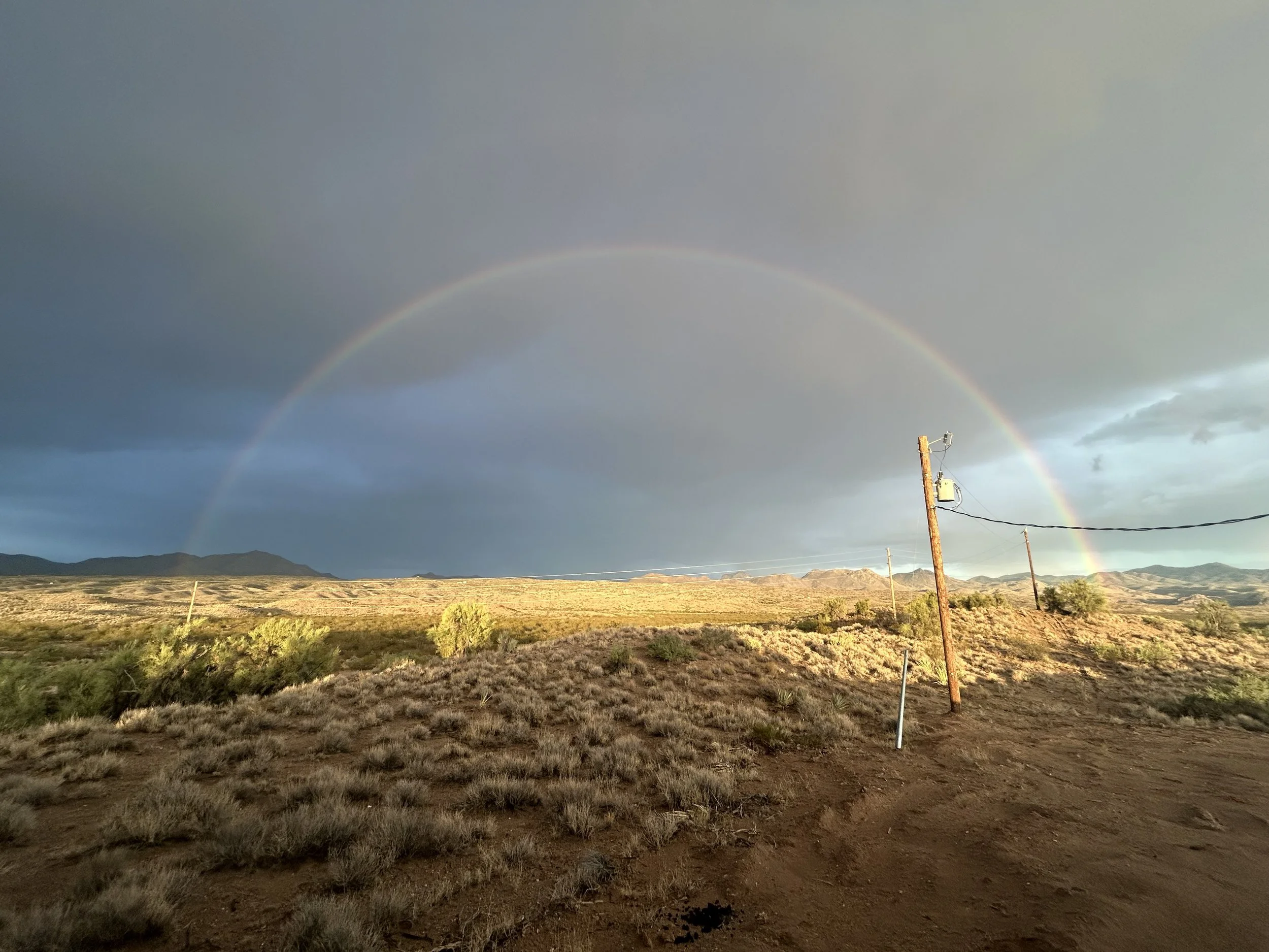 Beautiful double rainbow over retreat grounds showing Arizona desert