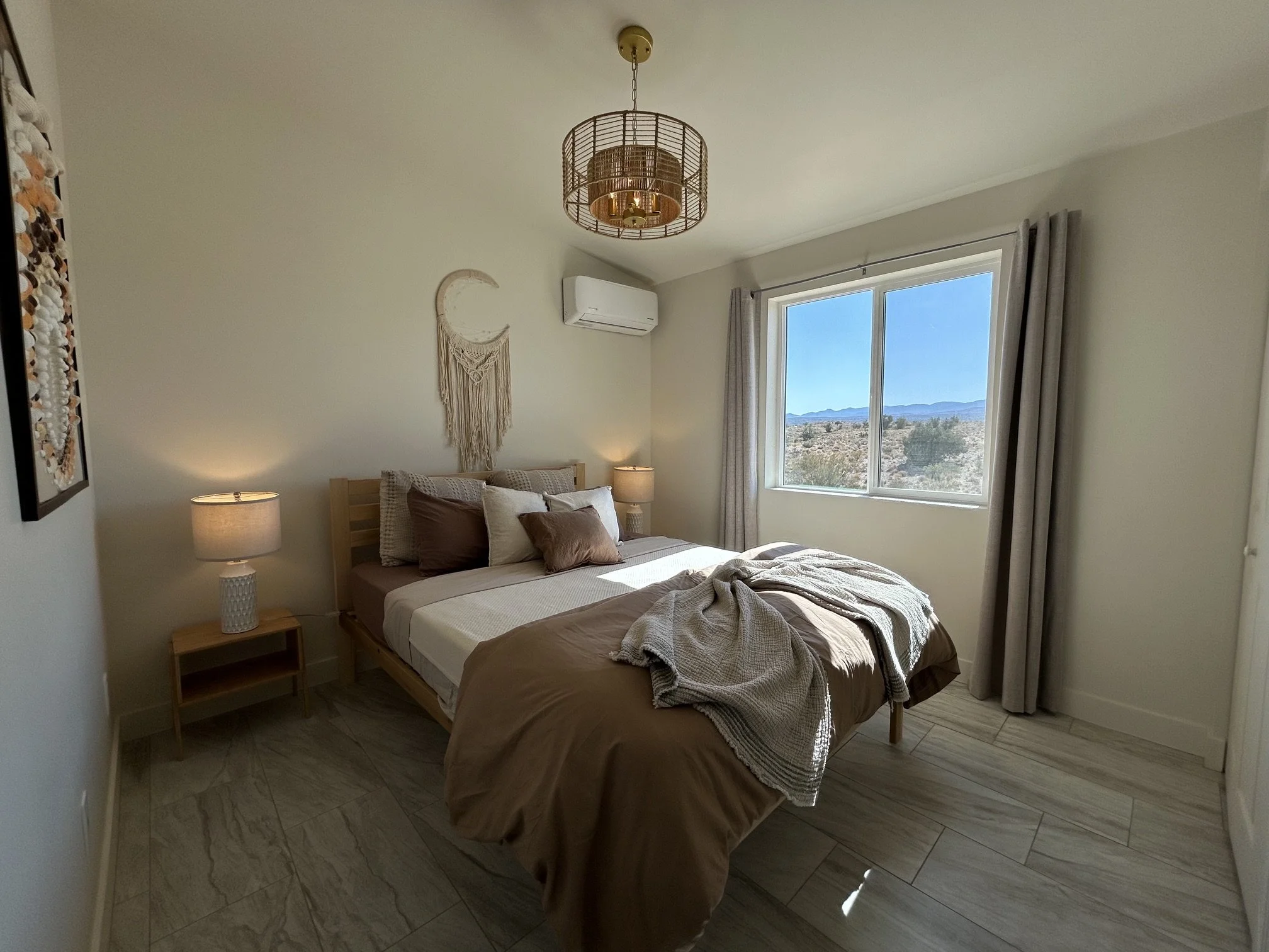 Peaceful private guest bedroom with desert views at The Butterfly Alchemy retreat in Arizona.